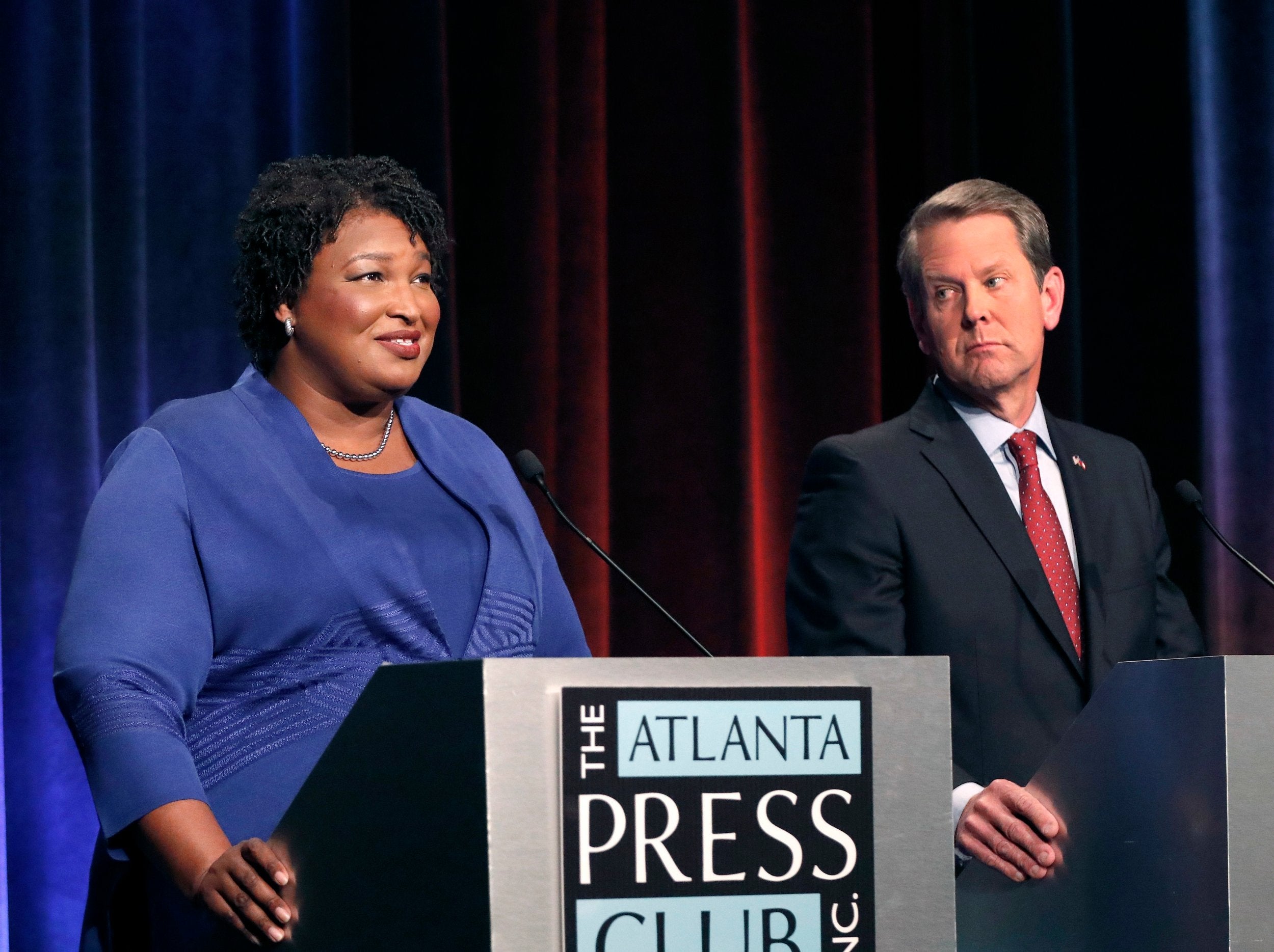 Democratic gubernatorial candidate for Georgia Stacey Abrams, left, speaks as her Republican opponent Secretary of State Brian Kemp looks on during a debate in Atlanta