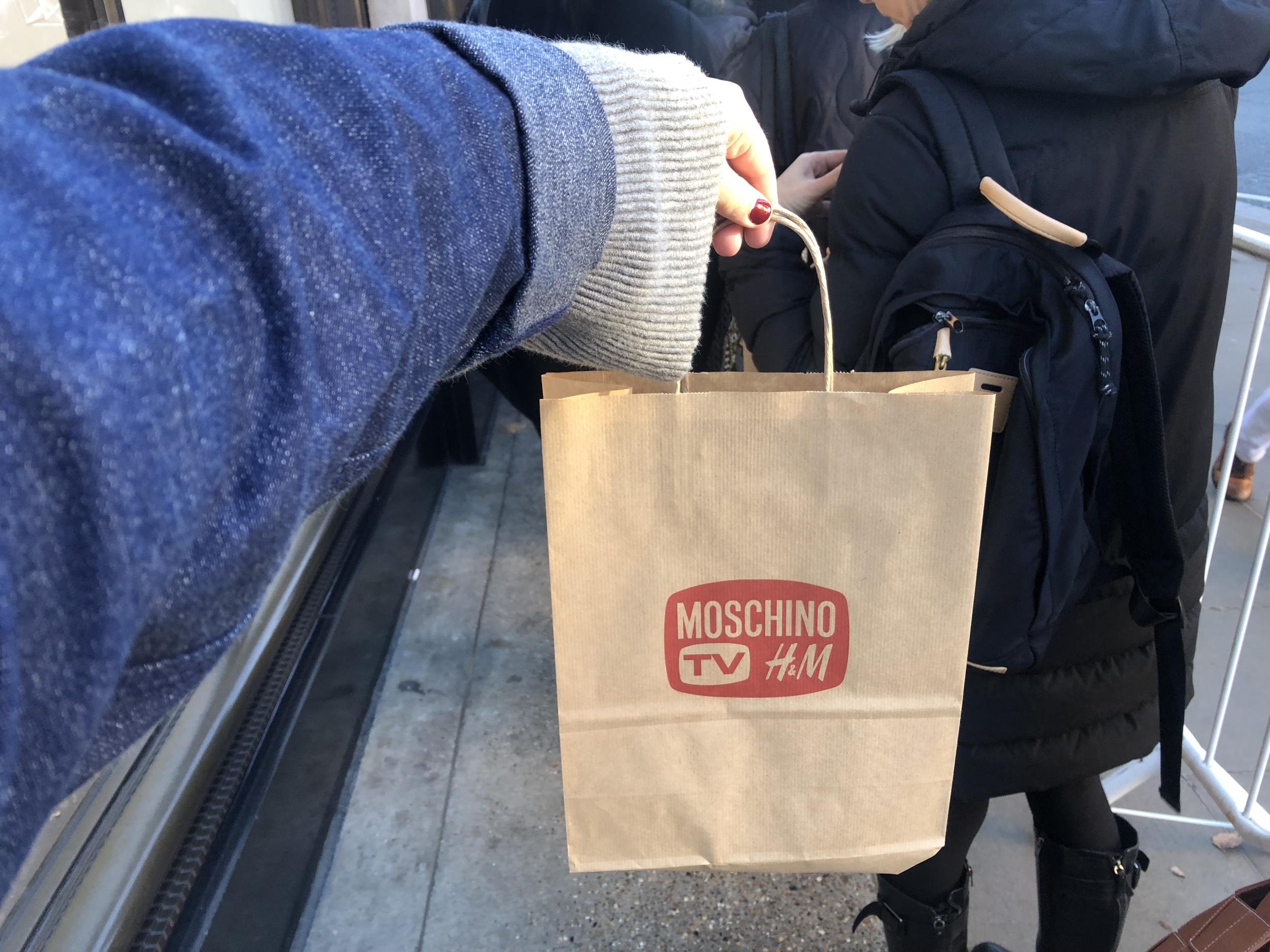 Every customer in the line at the High Street Kensington store was given a paper bag containing a mini water bottle and a cake pop.