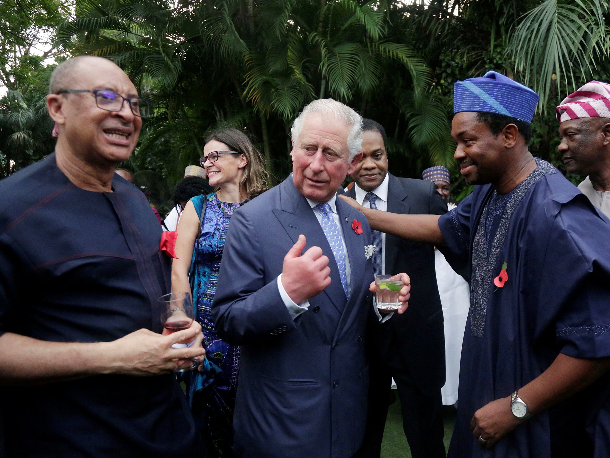 Britain's Prince Charles speaks with Commonwealth Walkway representatives, during a reception at the Deputy High Commissioner’s Residence in Lagos