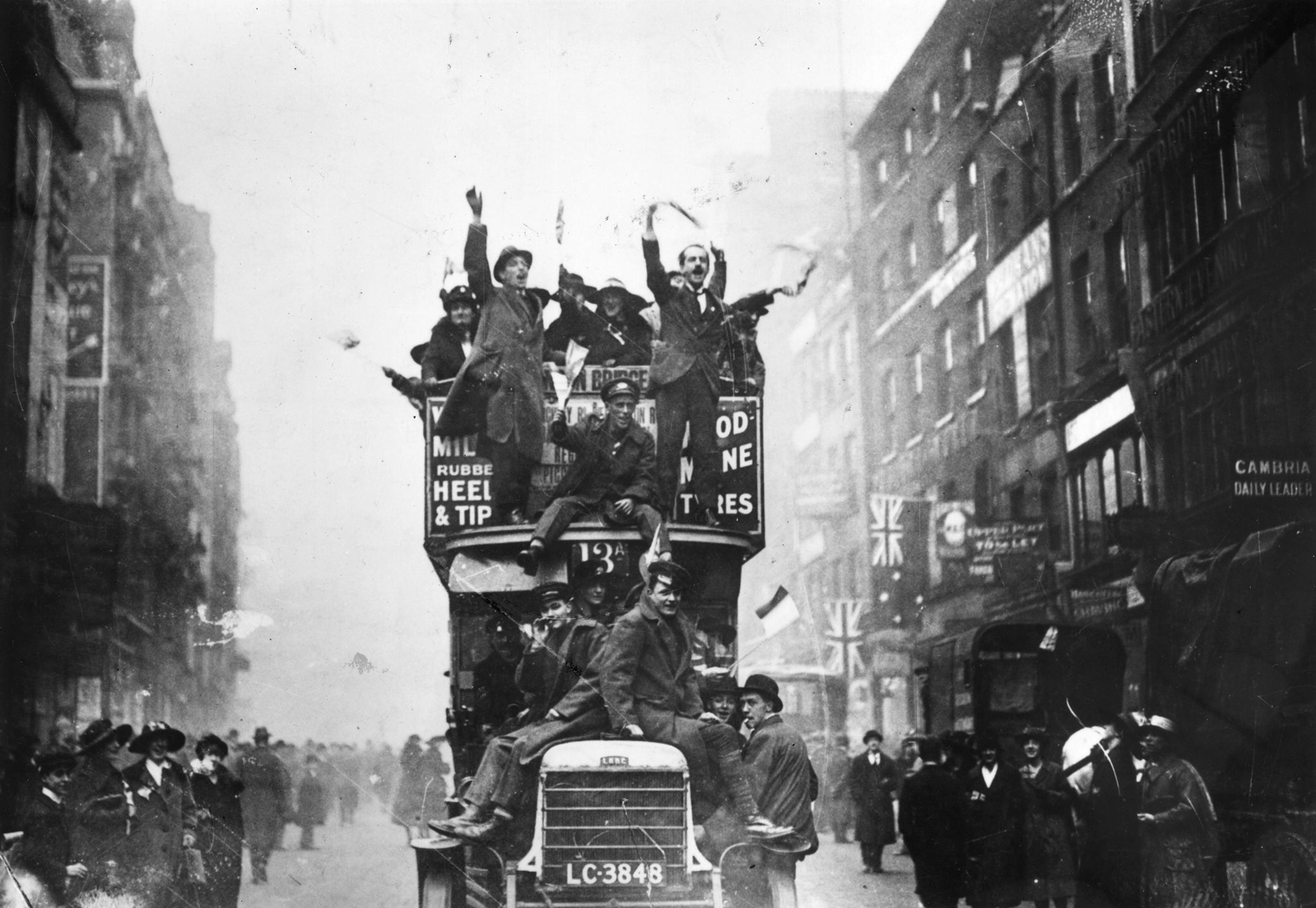 Crowds celebrating the signing of the armistice on 11 November: the news was yet to reach parts of the western front