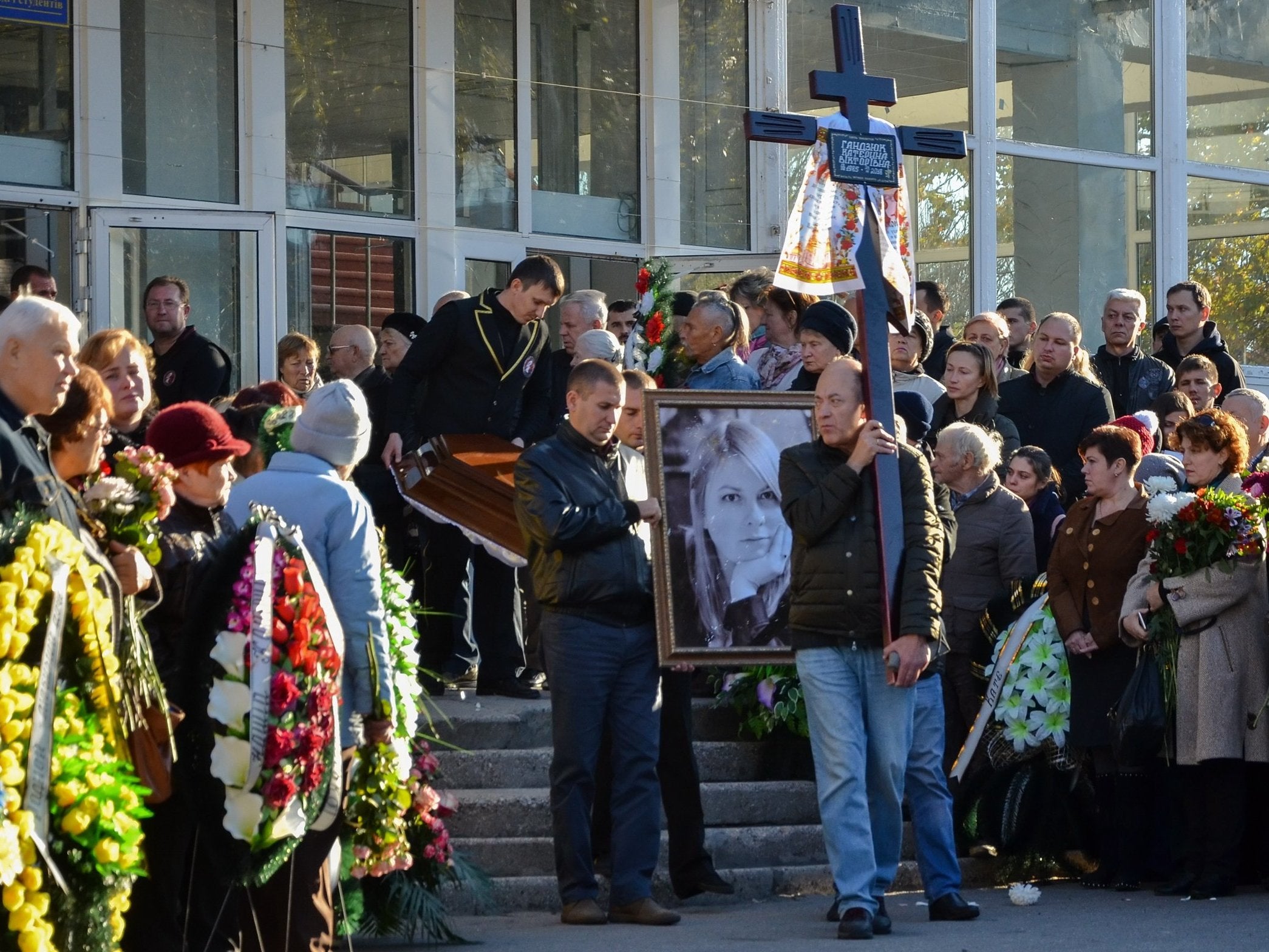 Ukrainians take part in the funeral ceremony of Kateryna Handziuk in Kherson, Ukraine, on Wednesday