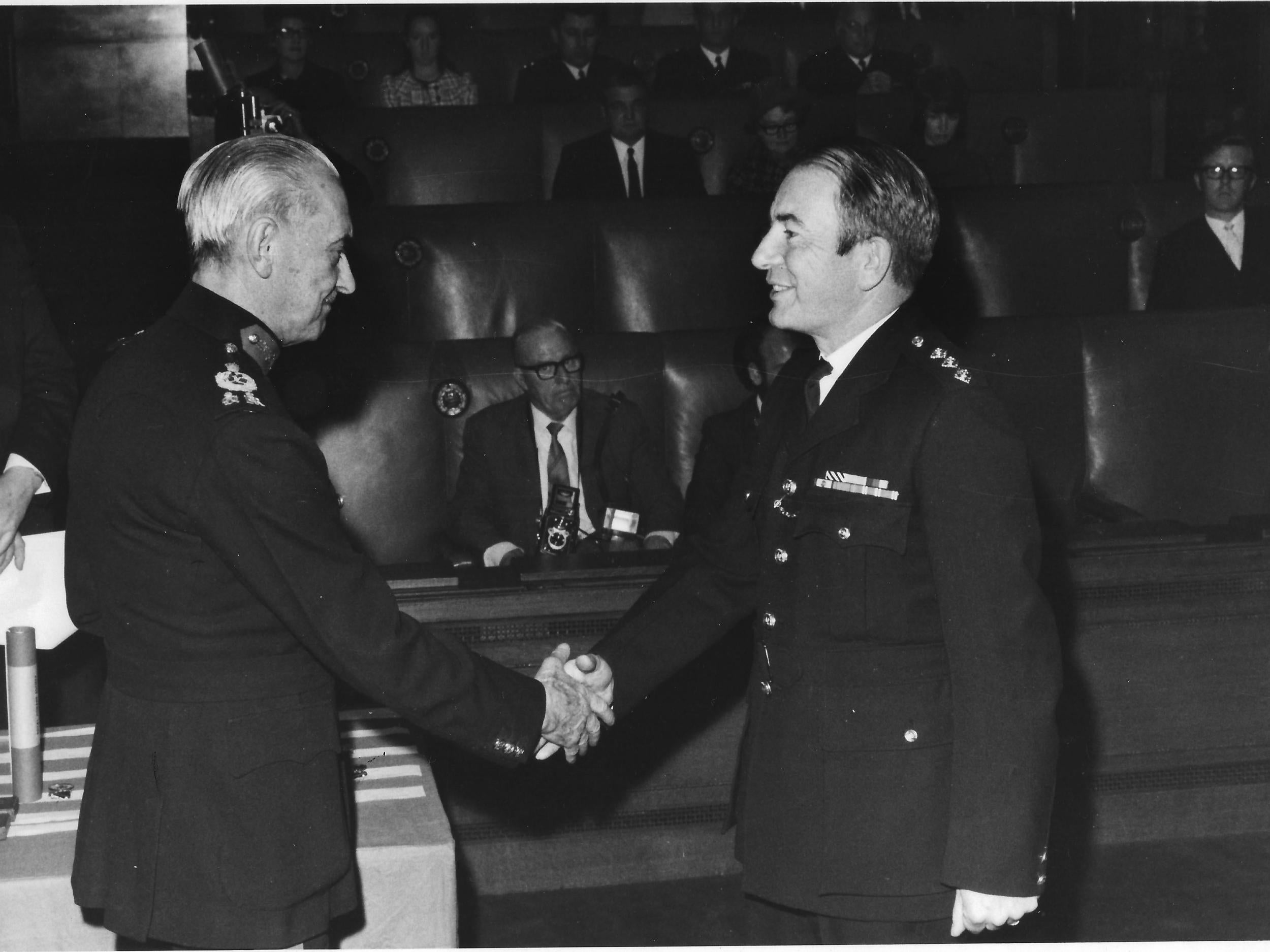 John Geddes receives his British Empire Medal from Sir Gerald Walter Robert Templer for his services to the police force