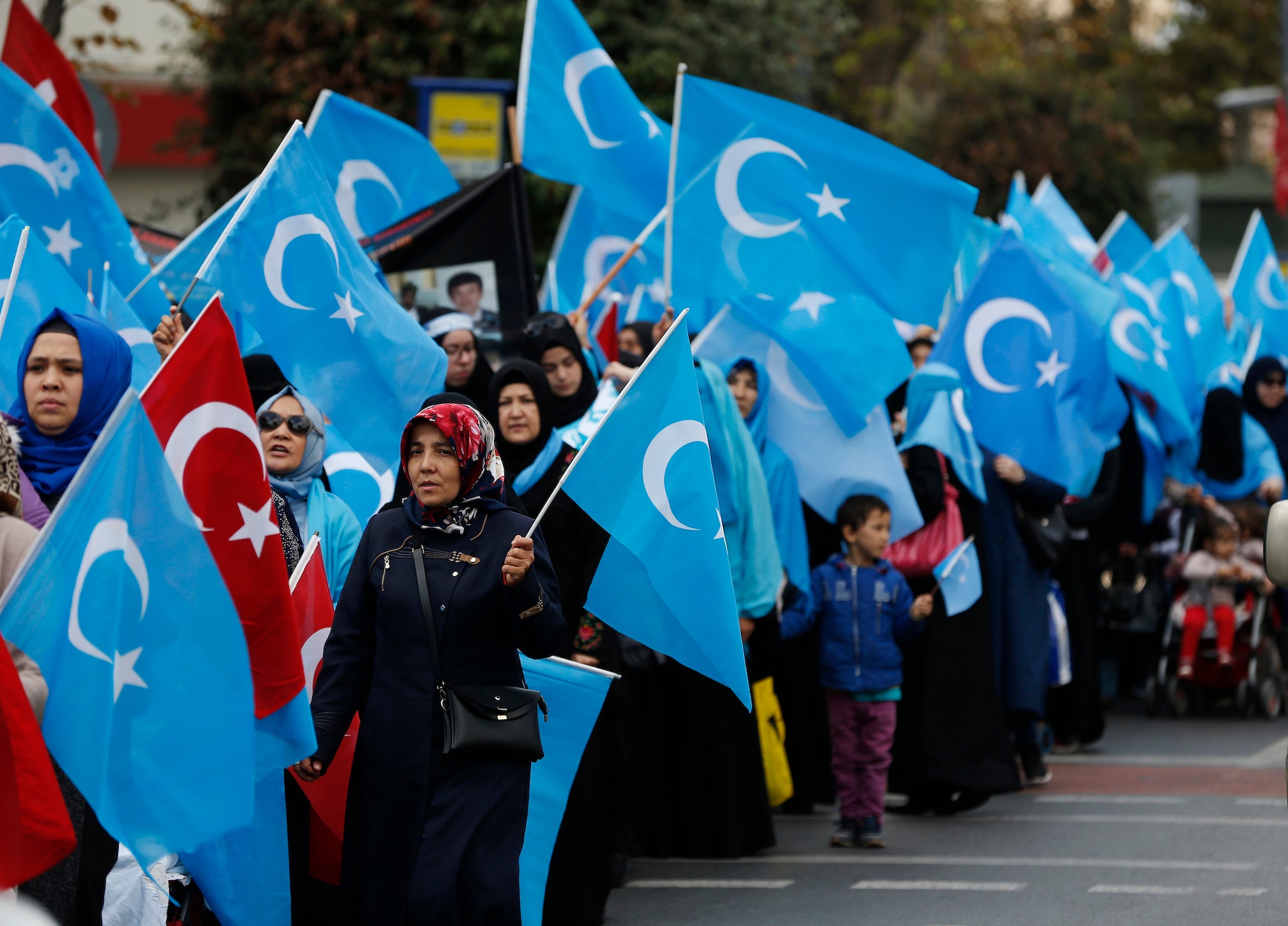 People from the Uighur community living in Turkey carry flags of what ethnic Uighurs call ‘East Turkestan’, during a protest in Istanbul on 6 November 2018 against what they allege is oppression by the Chinese government to Muslim Uighurs in the far-western Xinjiang province.