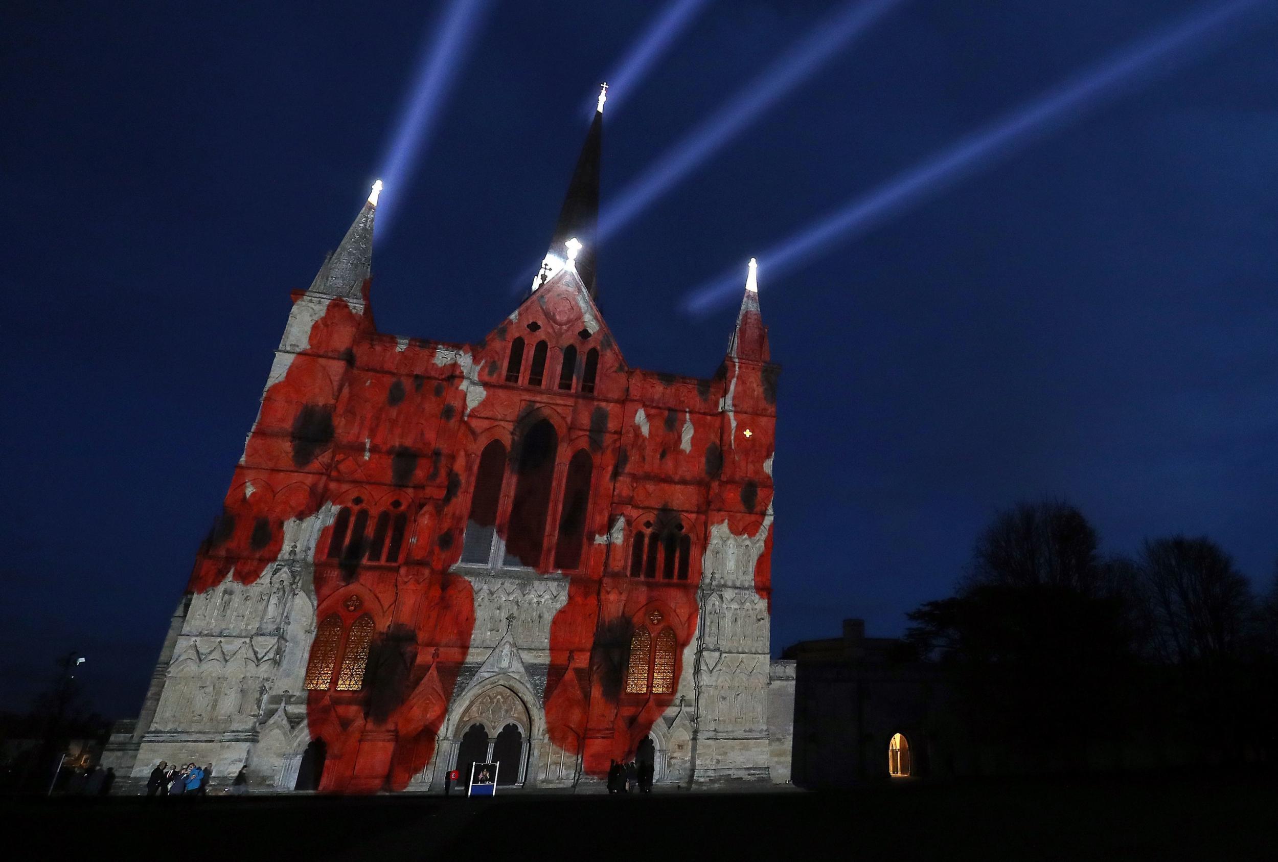 
The Royal British Legion’s Falling Poppies projection is displayed on the West Front of Salisbury Cathedral (Andrew Matthews/PA)