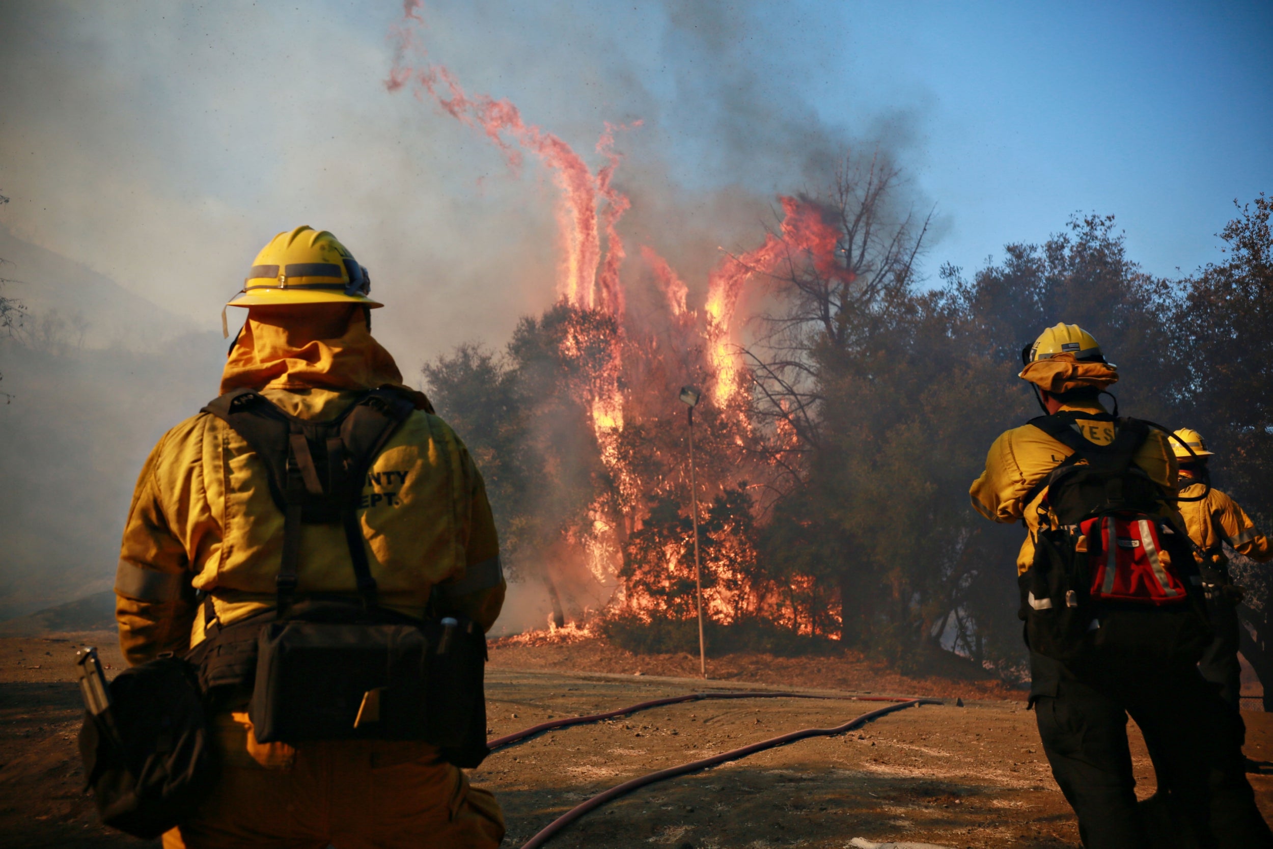 Firefighters battle a blaze at the Salvation Army Camp in Malibu