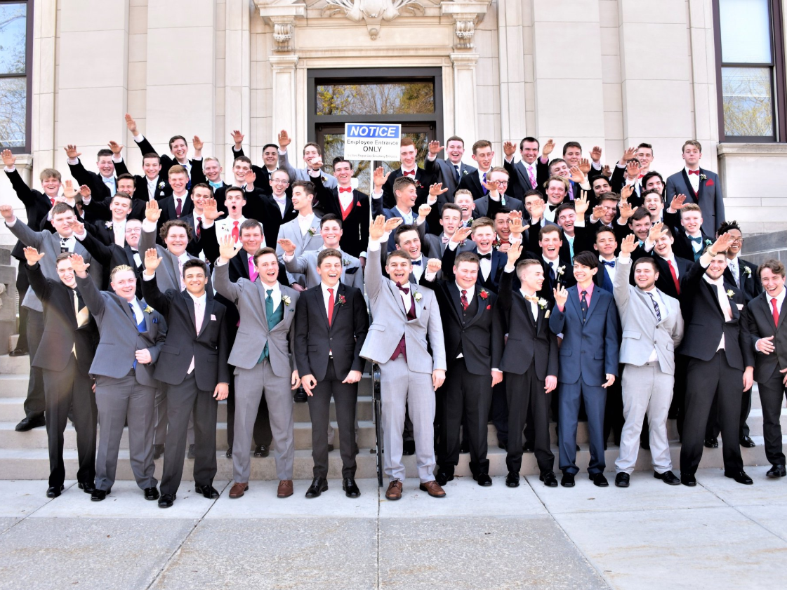 A group of young men, thought to be from a Wisconsin high school, perform Nazi salutes