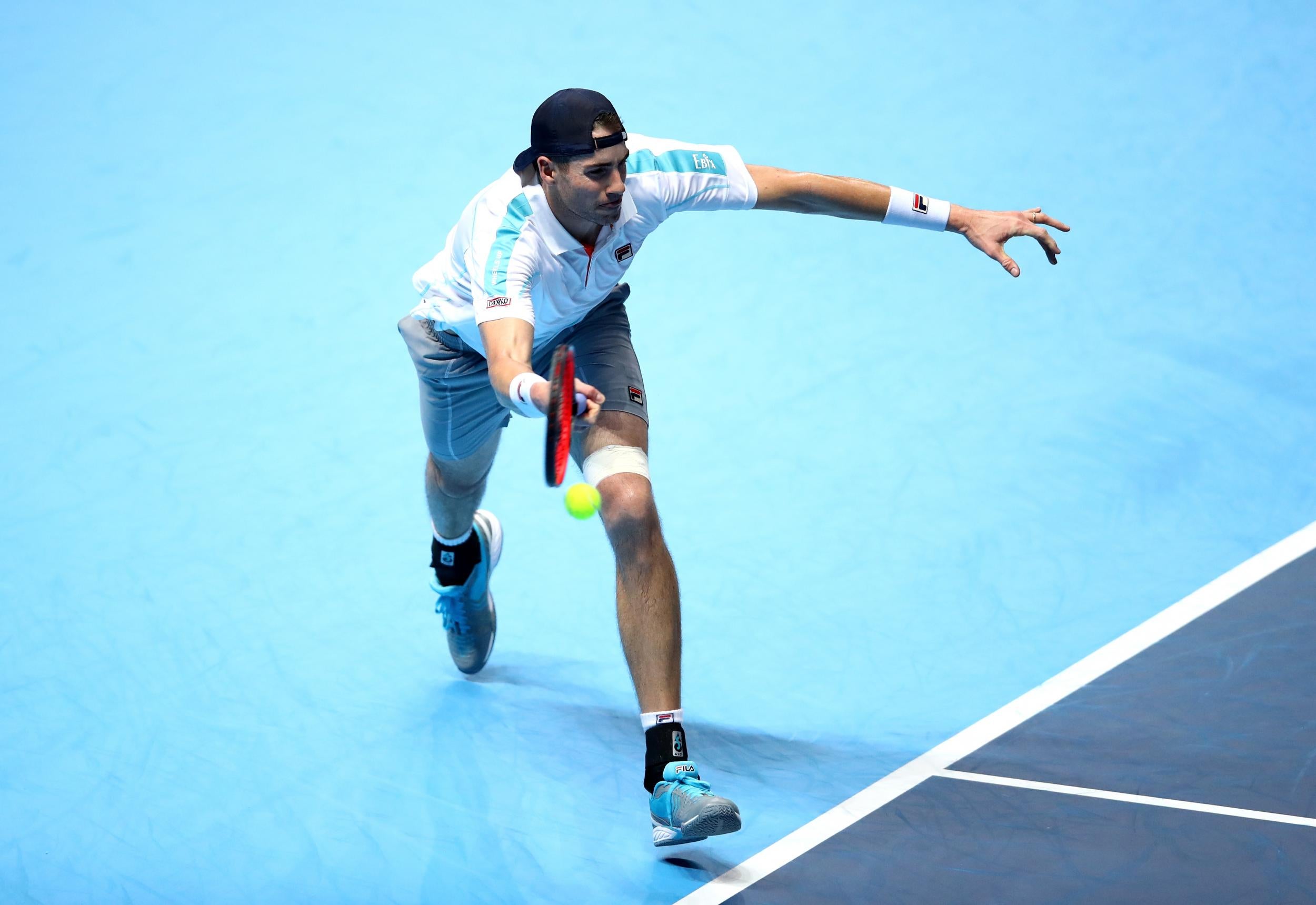 Big-serving Isner had no answer for Djokovic in his opening match at the O2 Arena