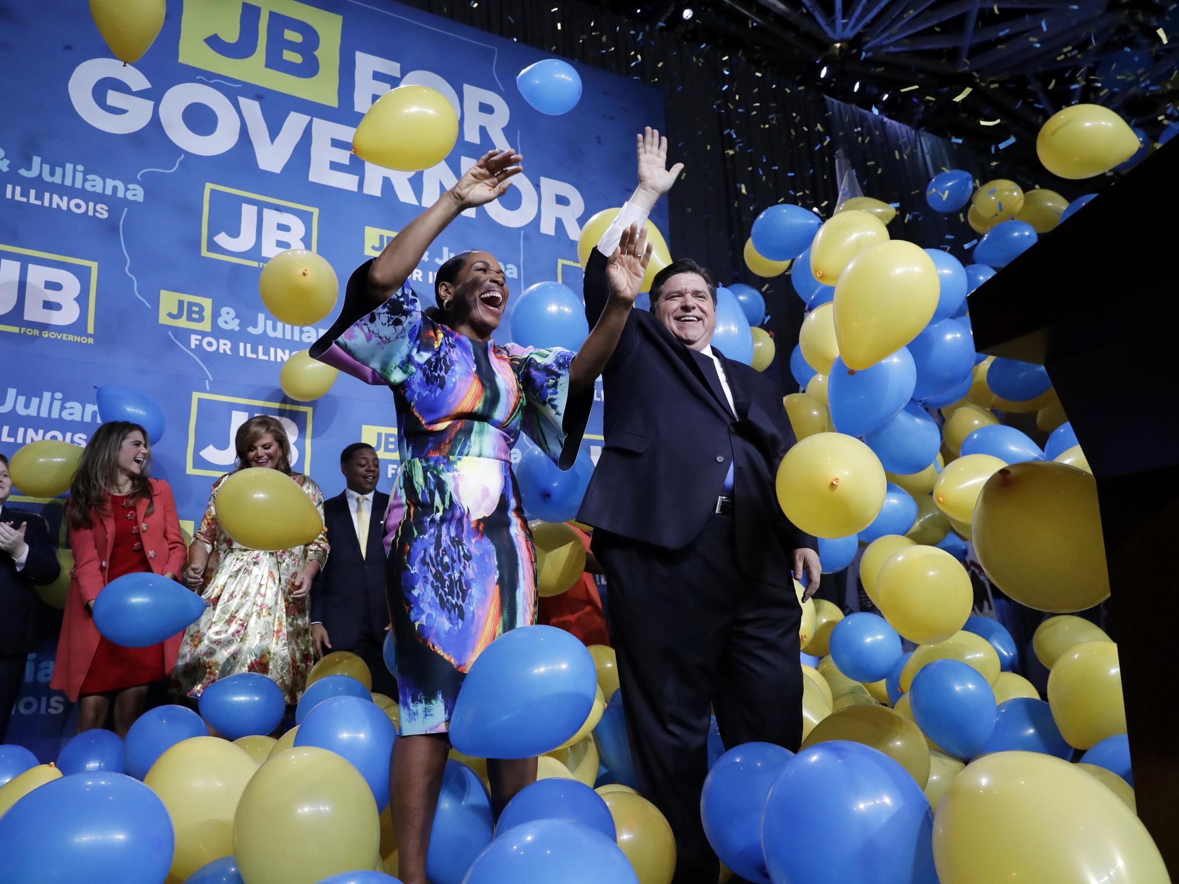 Democratic governor candidate J.B. Pritzker, right, and his running mate Juliana Stratton celebrate after beating Republican incumbent Bruce Rauner in Chicago