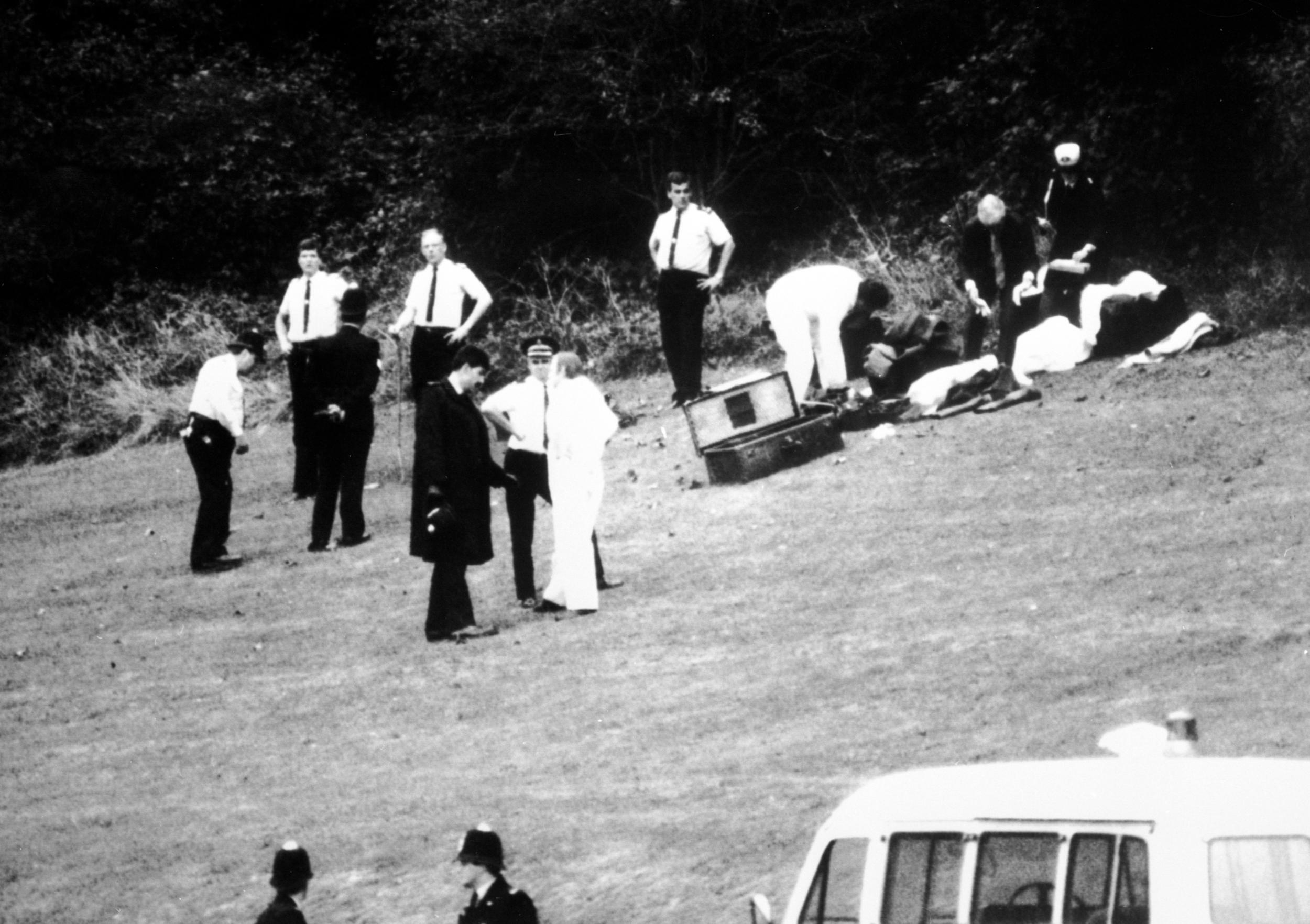 11 October 1986, Wild Park, Brighton: police forensic officers prepare to enter the ‘den’ where the bodies were found