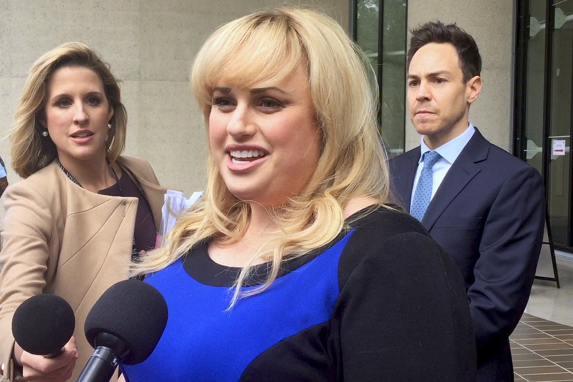 Rebel Wilson speaks to the media outside the High Court of Australia in Canberra, Australia, 16 November