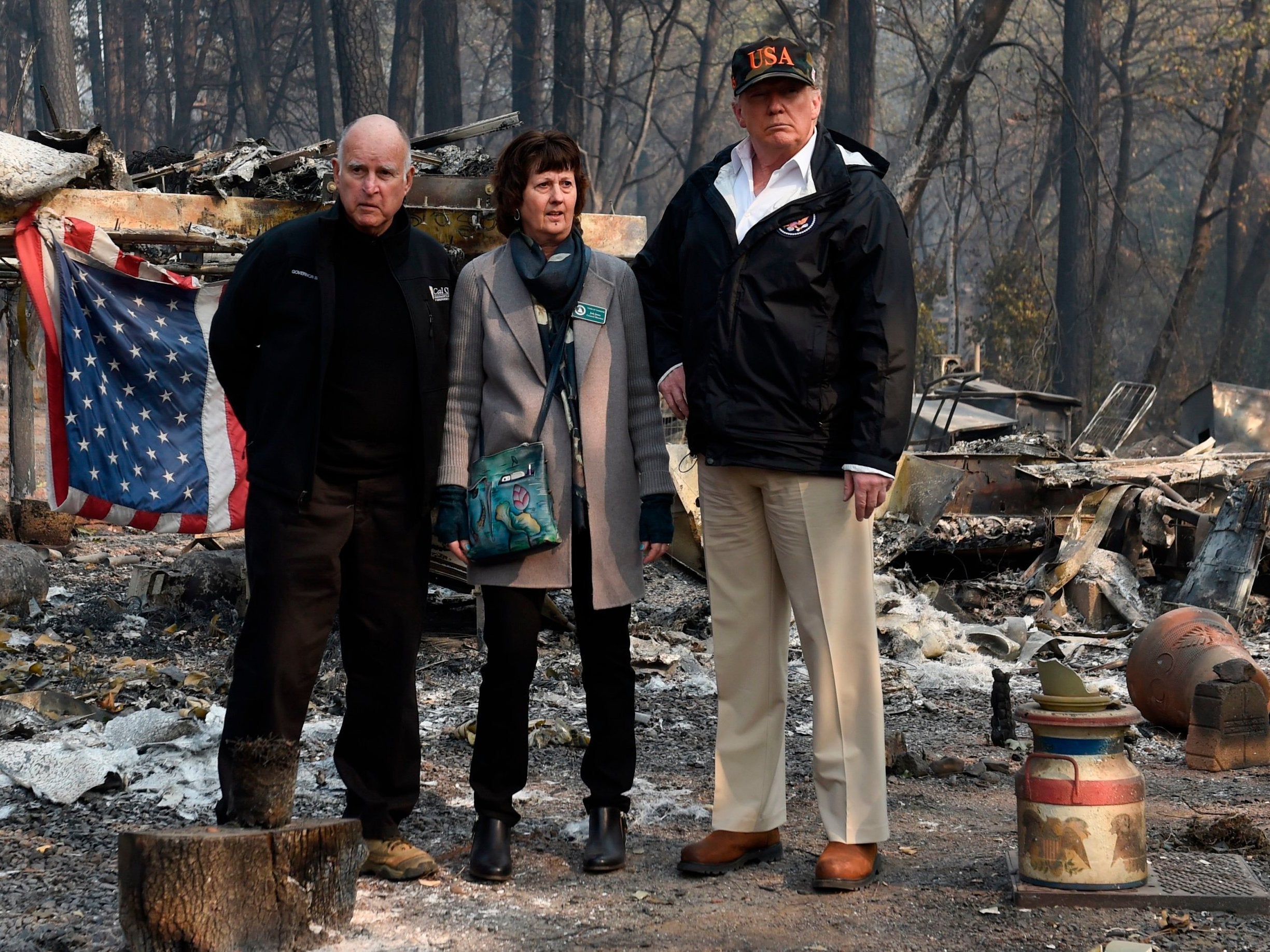 Donald Trump views the damage from wildfires with California governor Jerry Brown and Jody Jones, the mayor of Paradise (AFP/Getty)