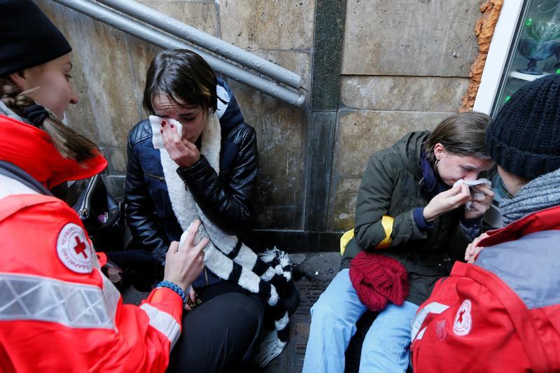 Demonstrators get medical help during a rally for transgender rights in Kiev, Ukraine