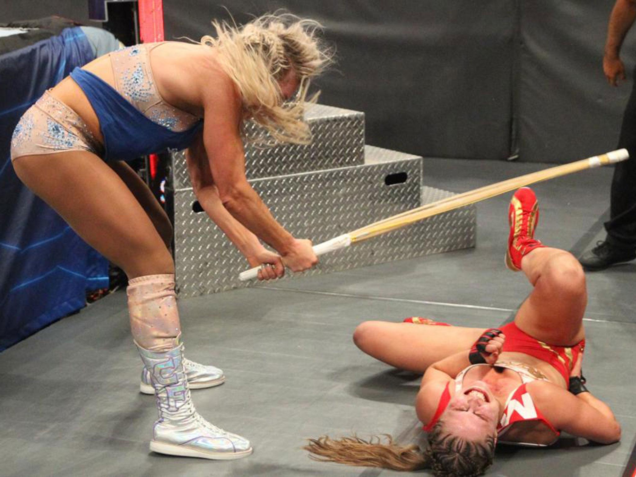 Charlotte attacks Rousey after being disqualified