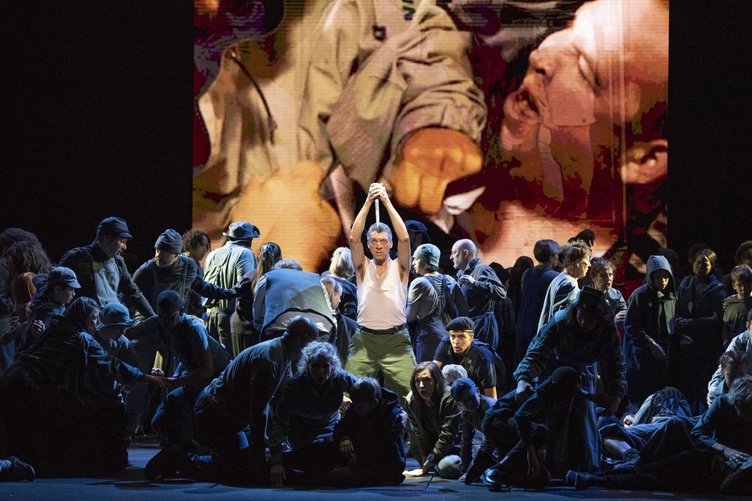 There are searing performances, including by baritone Roderick Williams (centre), in this production of Britten's great choral work