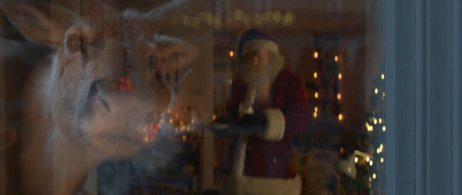 In the ad, reindeer look on as Santa indulges in mince pie (McDonald's)