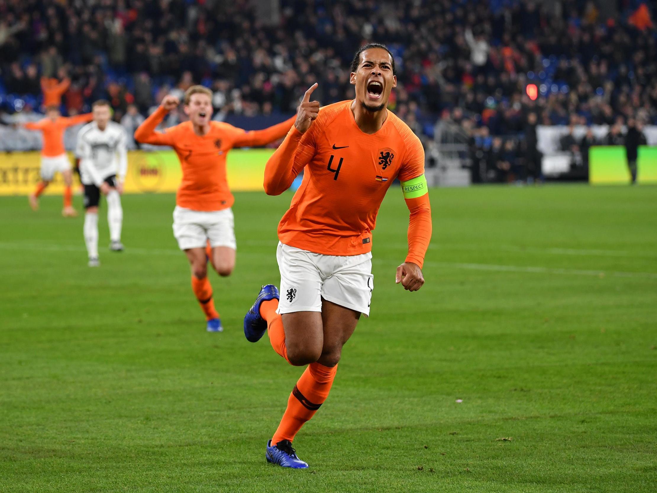 Virgil van Dijk celebrates his late equaliser for the Netherlands