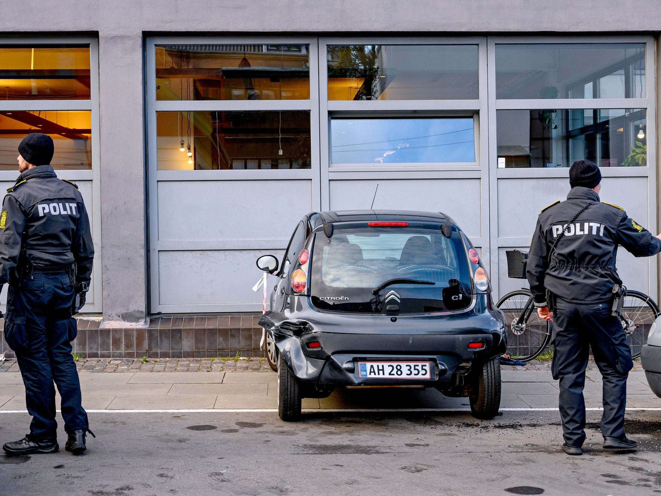 Police investigate the scene of the shooting after the book launch in Copenhagen