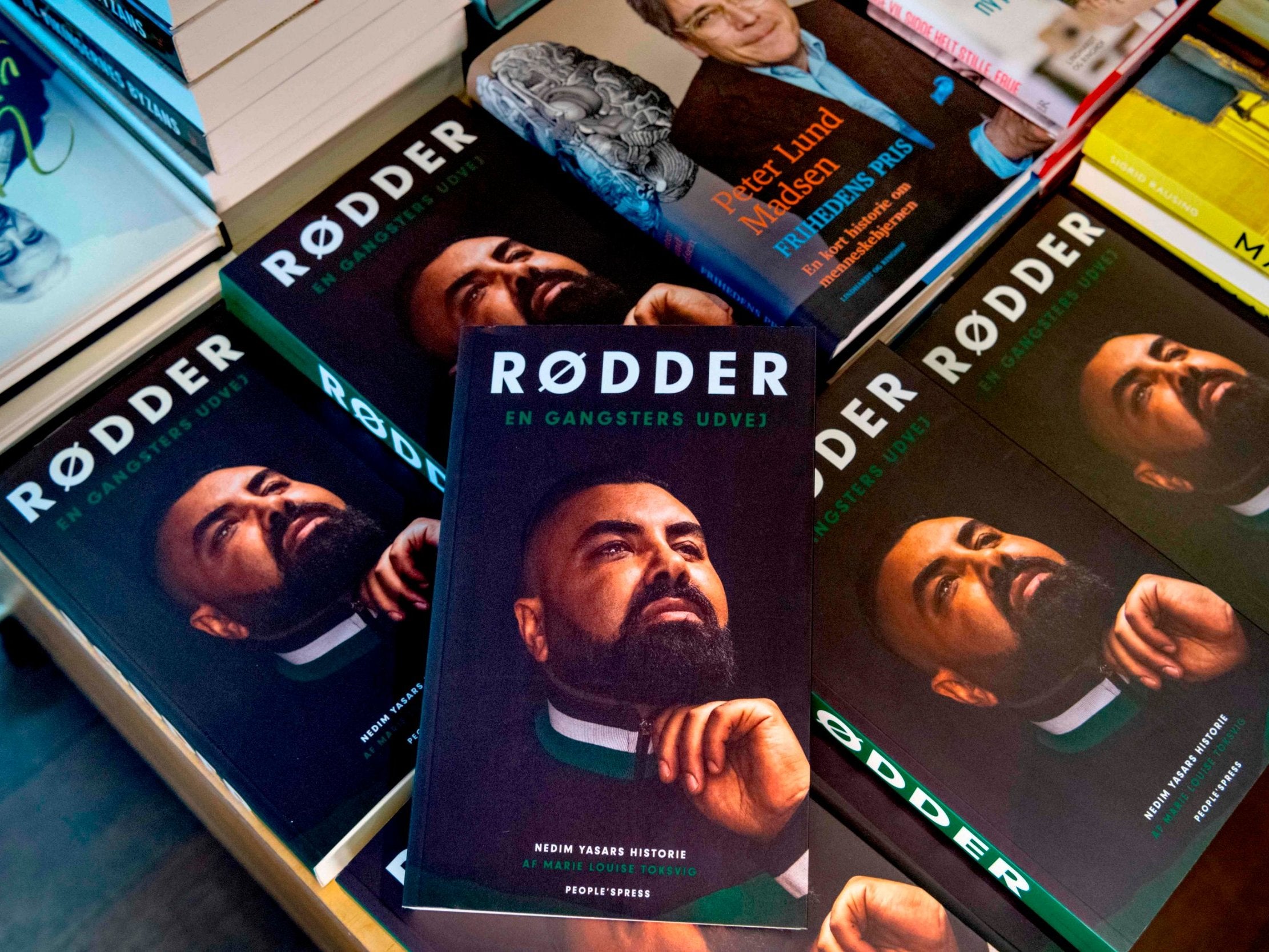 Copies of Yasar's memoir 'Roots - A gangster's way out' displayed in a bookstore