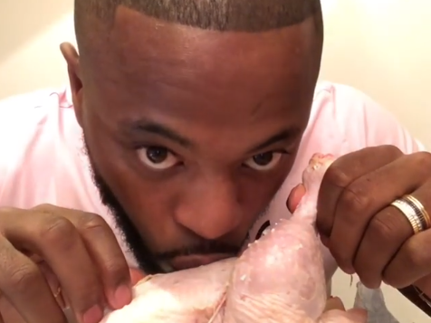 Patrice Evra kisses a raw chicken in an unusual video