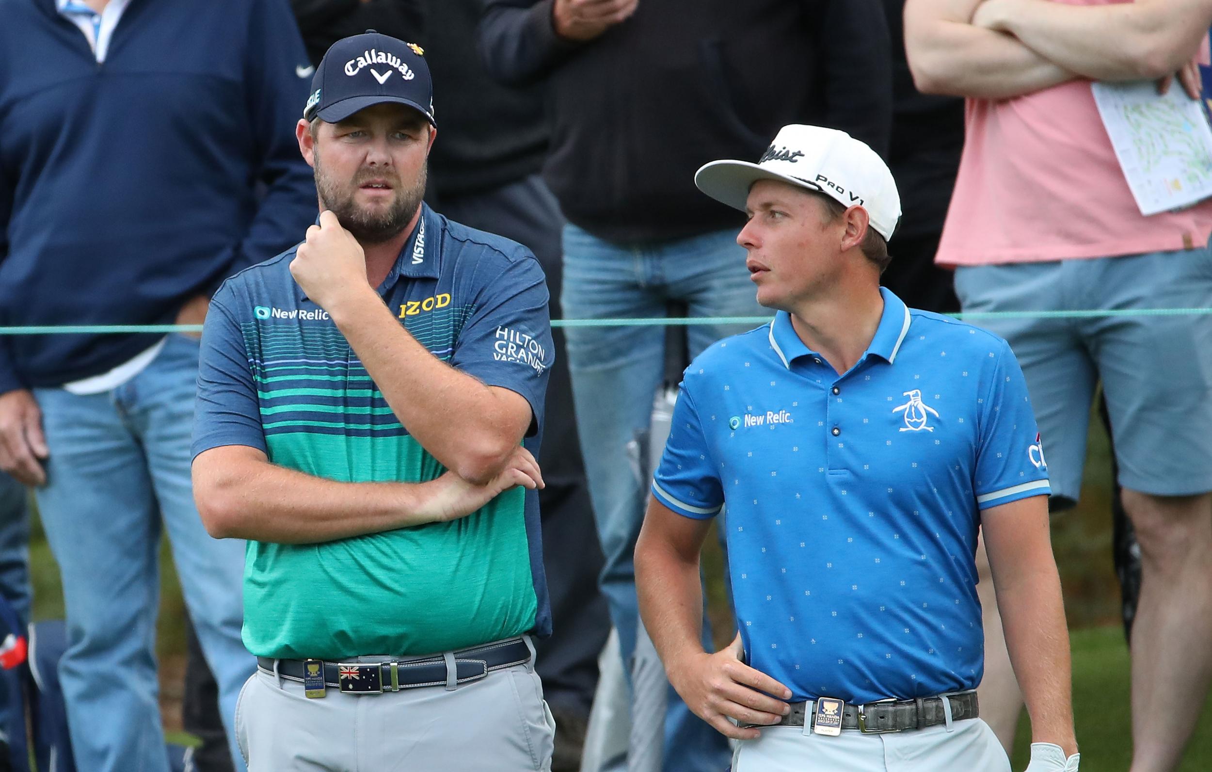 Mark Leishman (left) and Cameron Smith (right) put Australia in a share of the lead on the final hole
