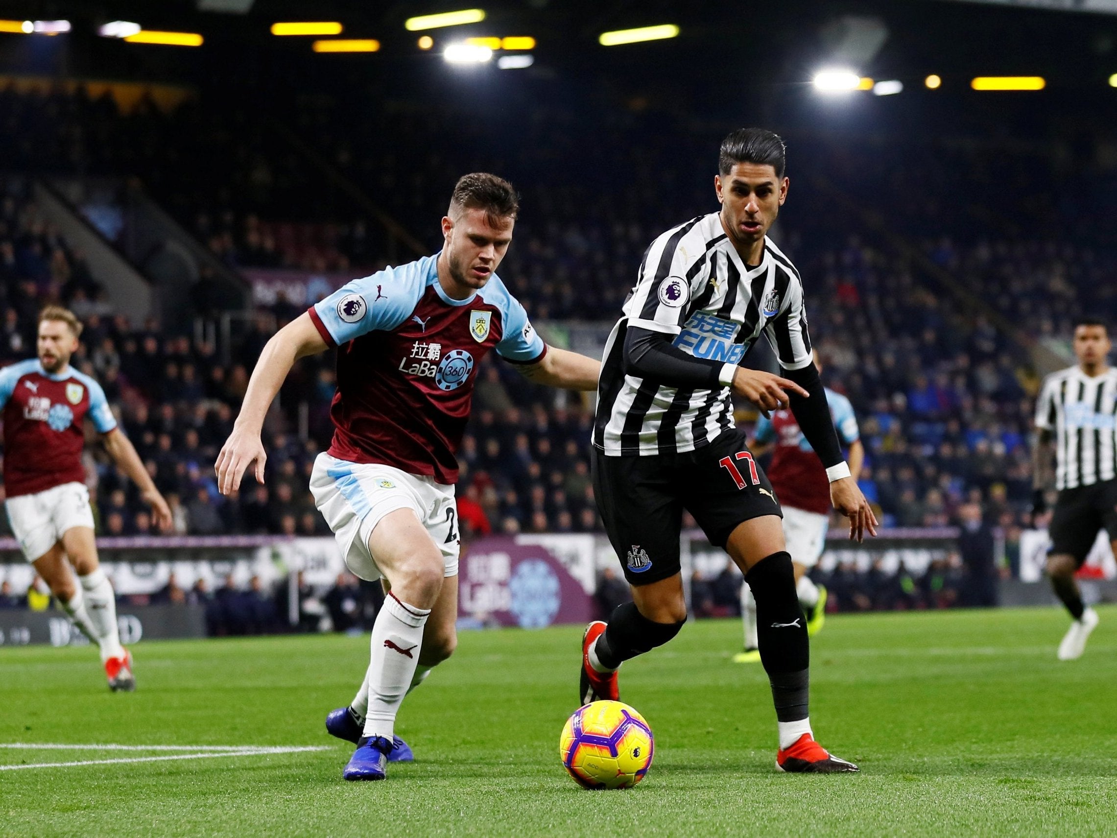 Ayoze Perez, right, chases Burnley's Kevin Long