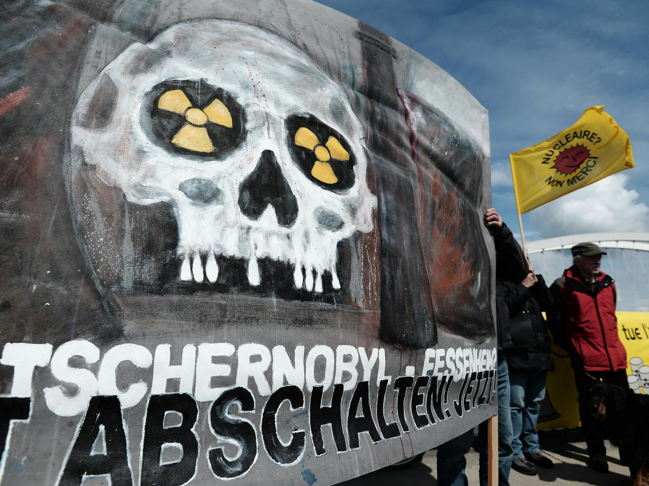 French and German anti-nuclear activists pictured on 24 April 2016 during a commemoration of the Chernobyl nuclear disaster and to protest against the nuclear power plant in Fessenheim, France, the country's oldest reactor (Frederick Florin/