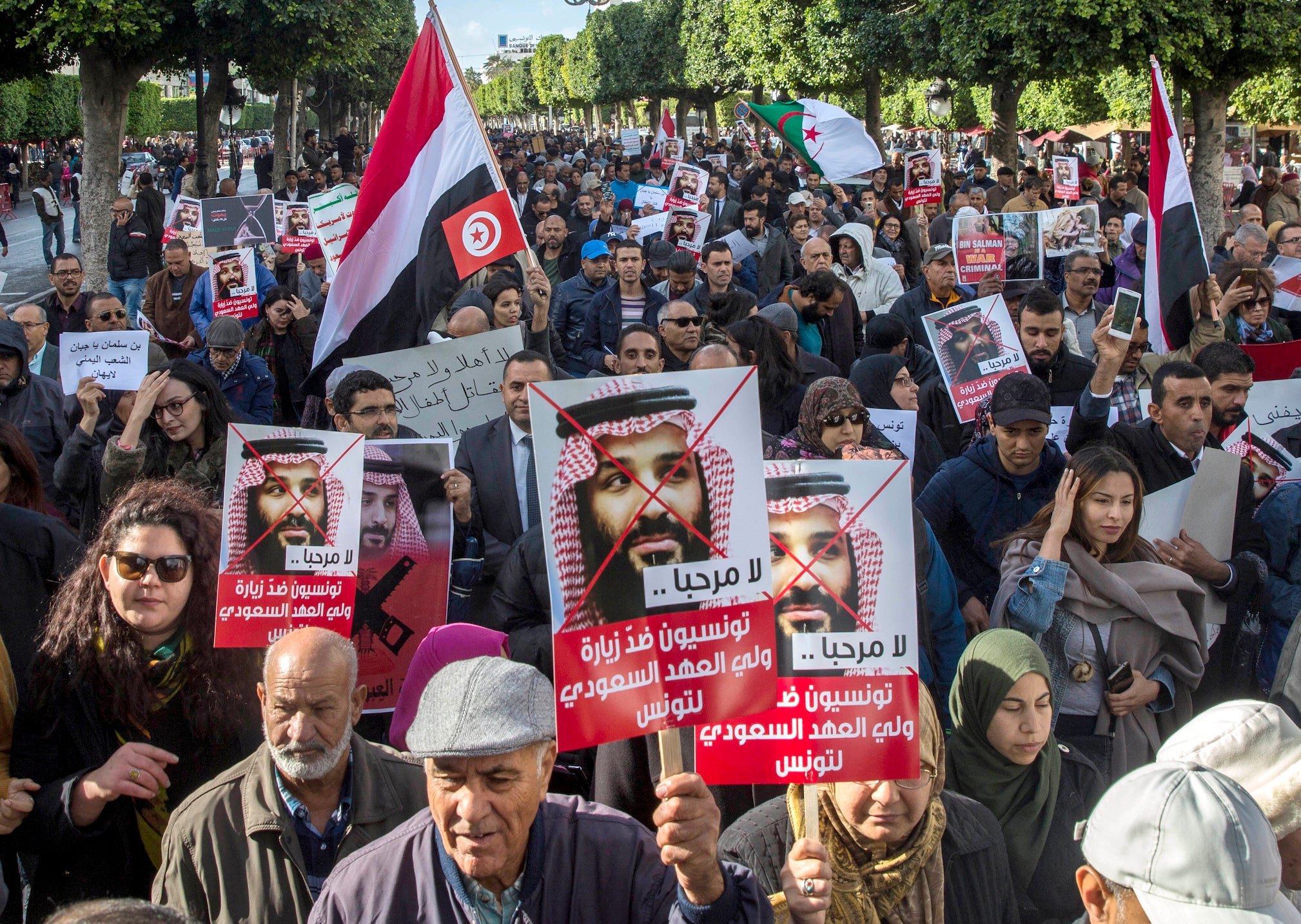 Tunisians demonstrate with placards reading ‘You are not welcomed’