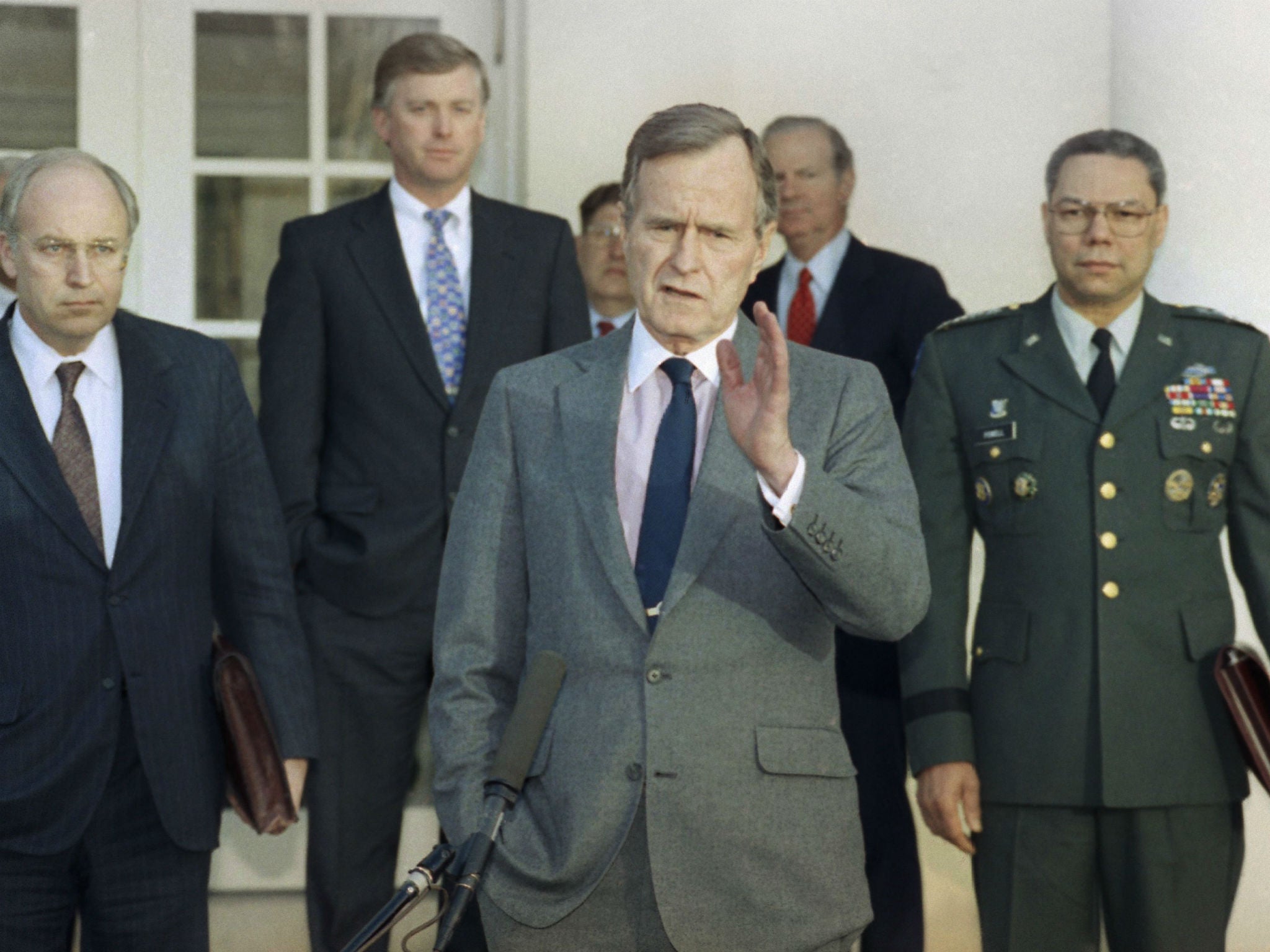 George HW Bush in the Rose Garden of the White House after meeting with top military advisors to discuss the Gulf War in 1991