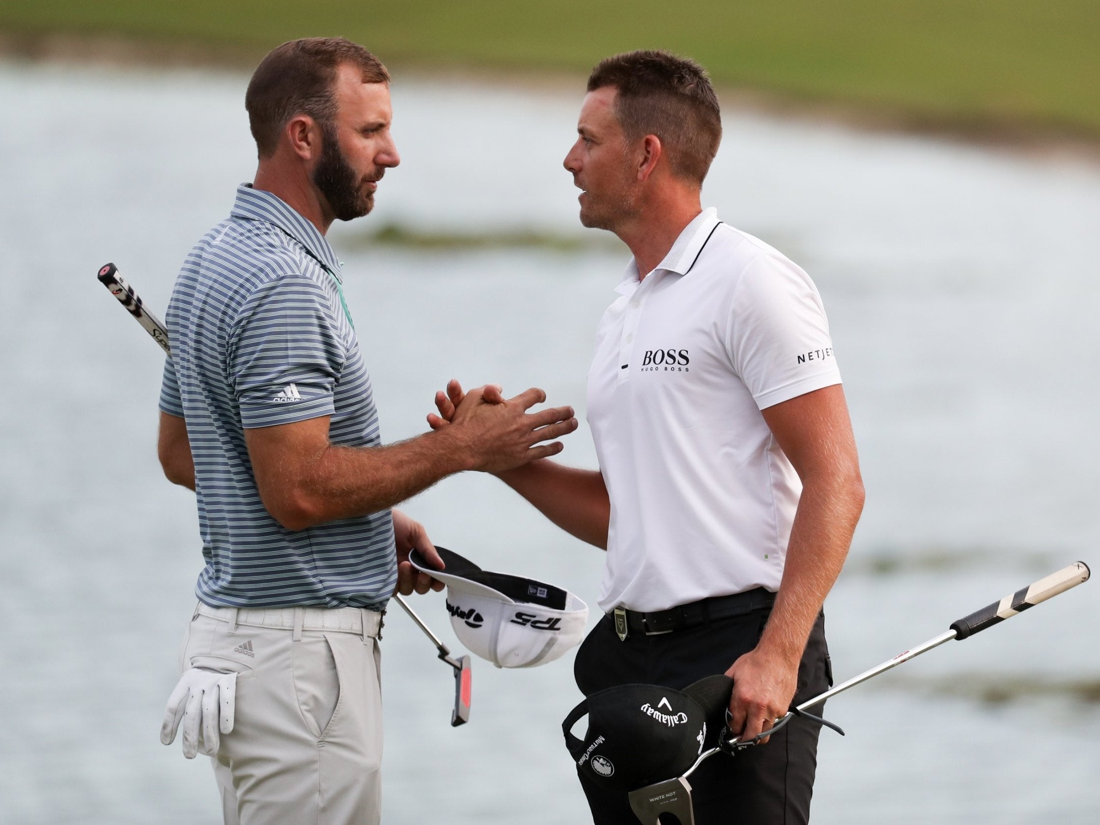 Henrik Stenson (right) holds a share of the lead after day two