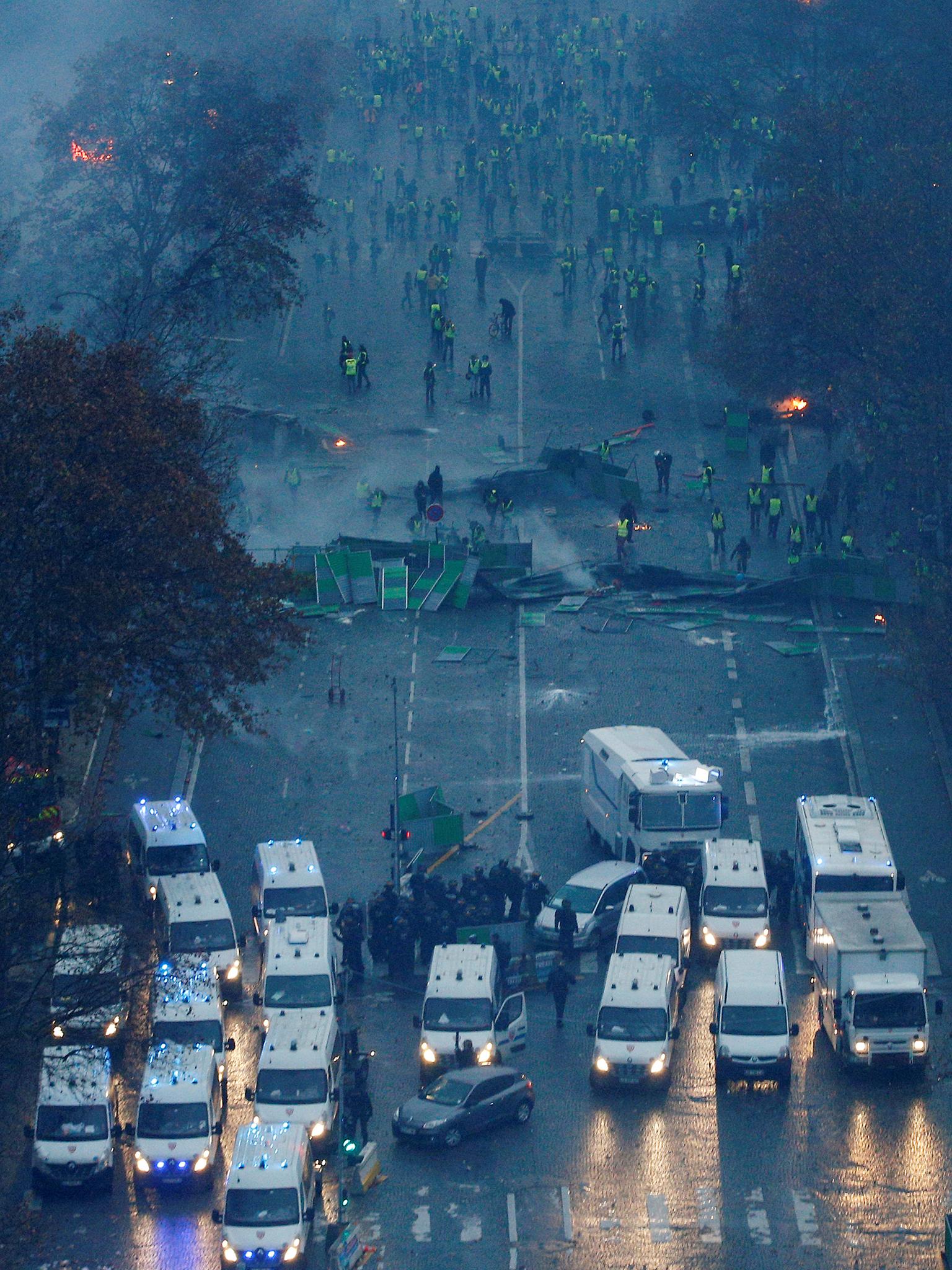 Protesters form a barricade on the Champs-Élysées