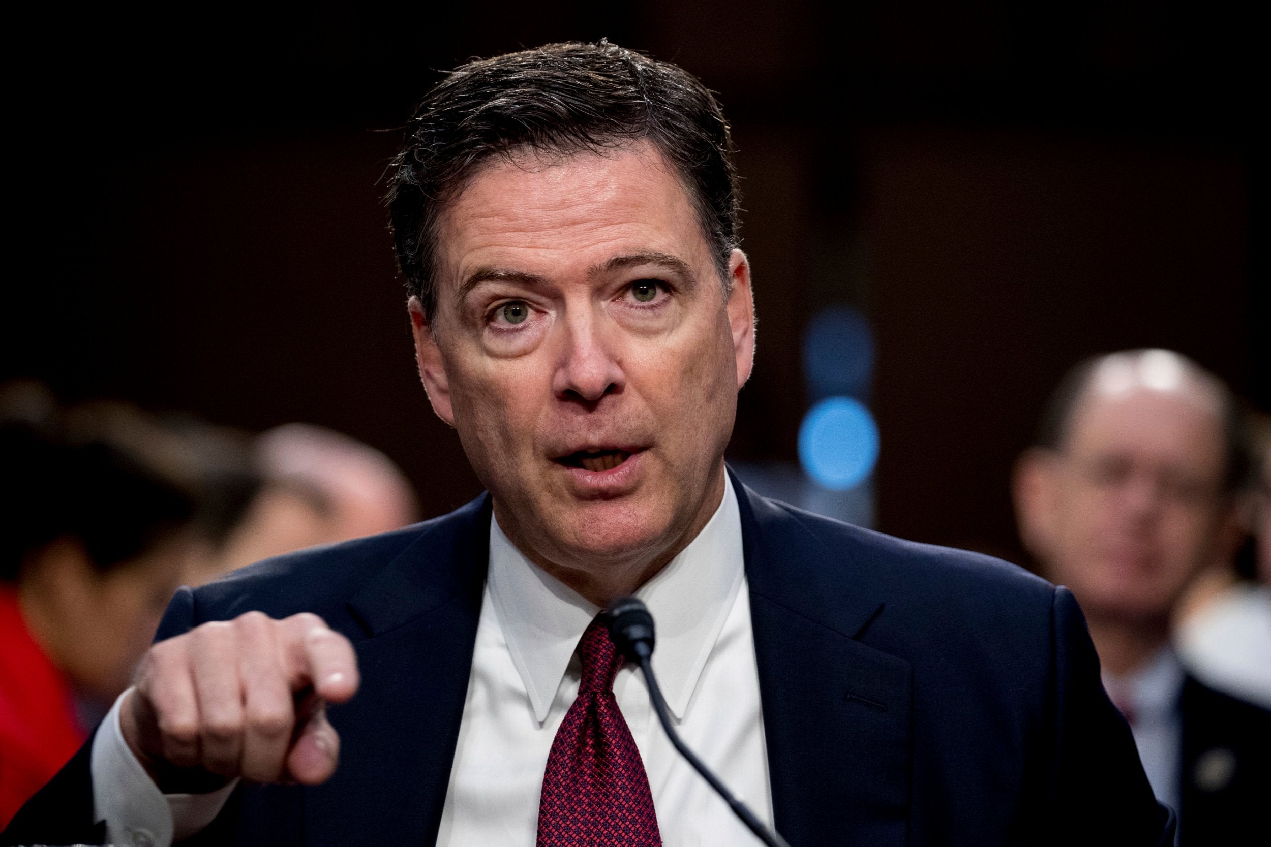 Former FBI director James Comey speaks during a Senate Intelligence Committee hearing