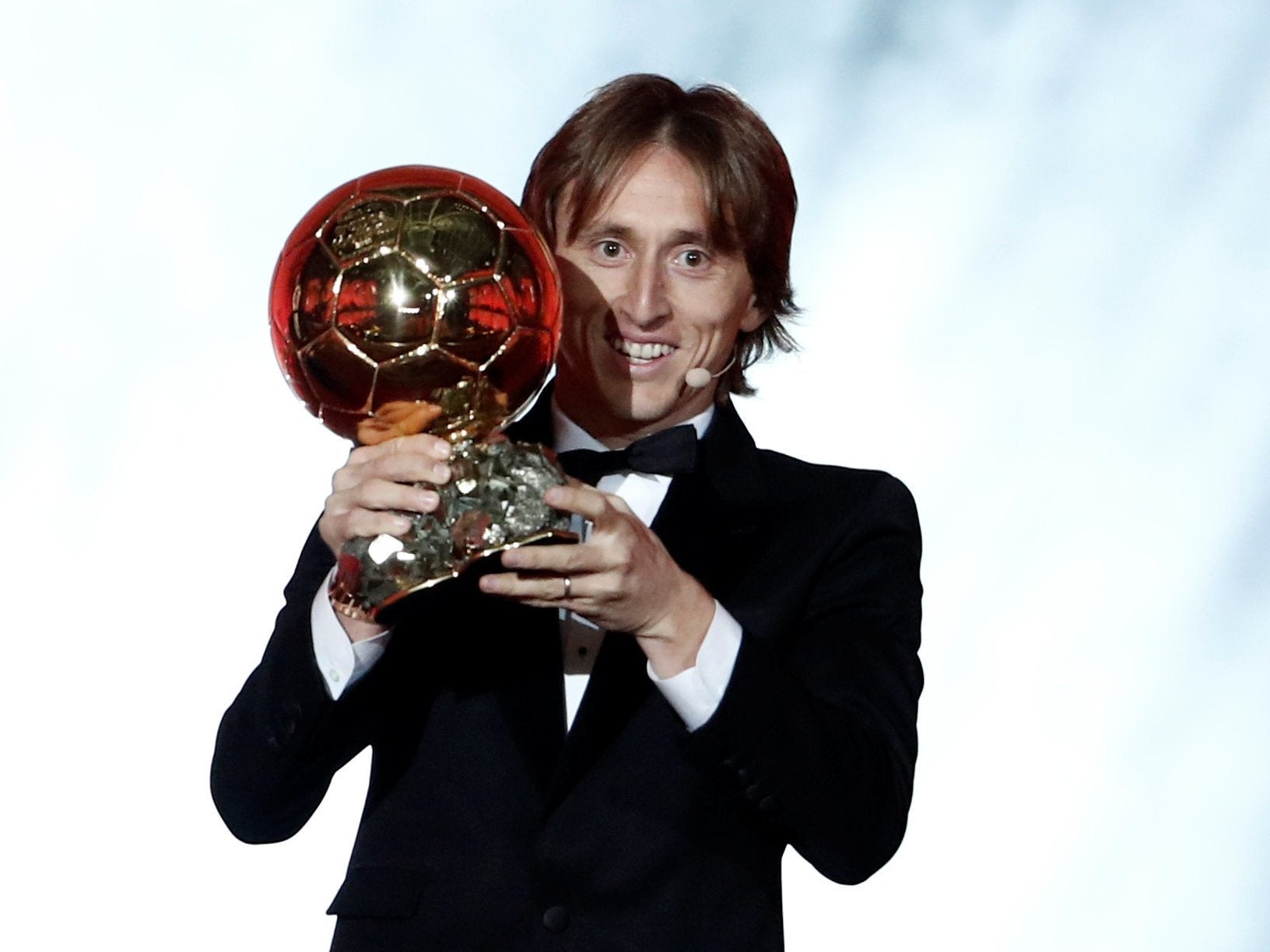 Luka Modric celebrates with the Ballon d’Or