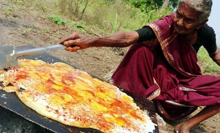 Mastanamma effortlessly squatted to cook over a fire despite her years