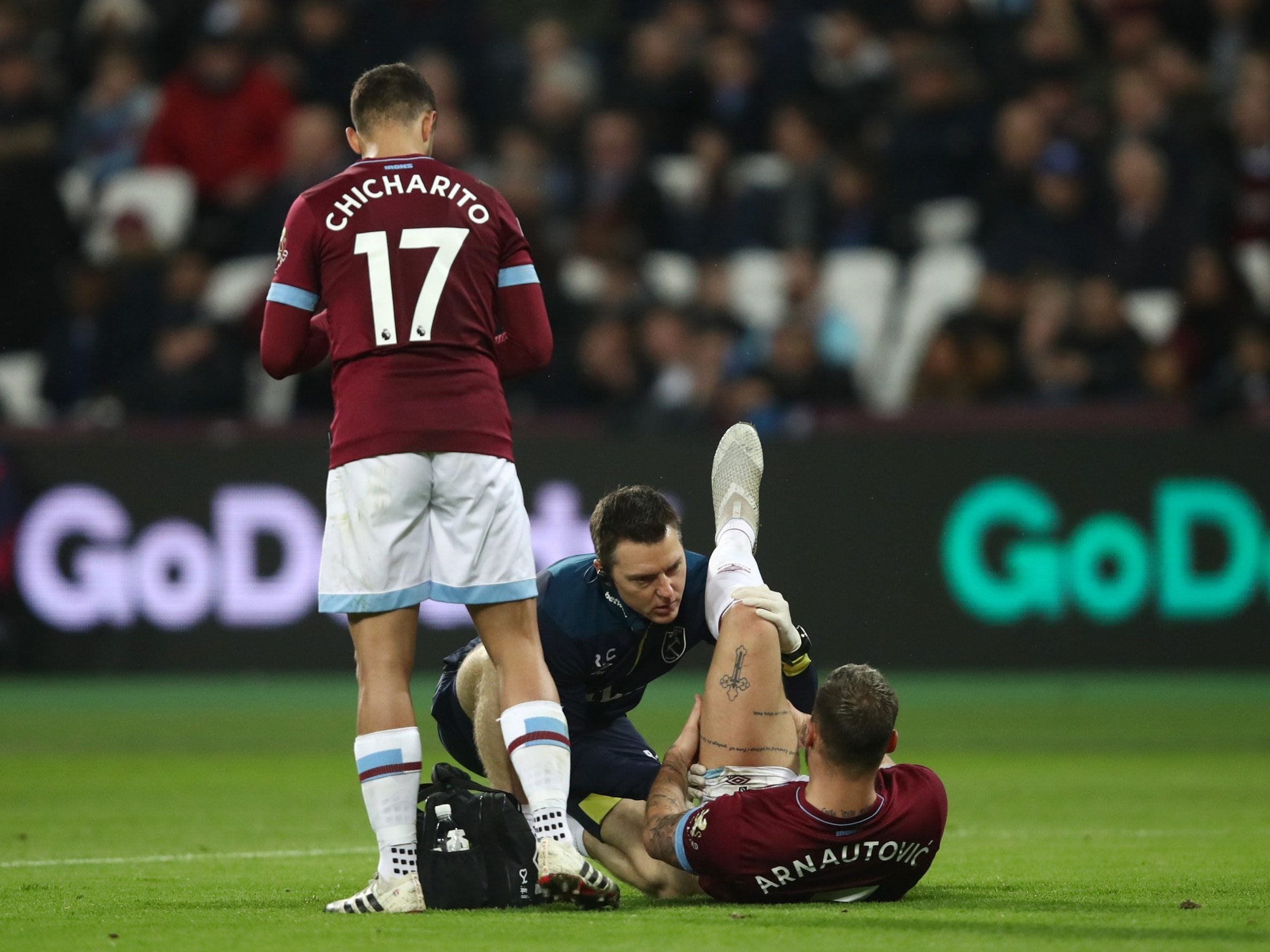 The Austrian goes down injured against Cardiff (Getty )