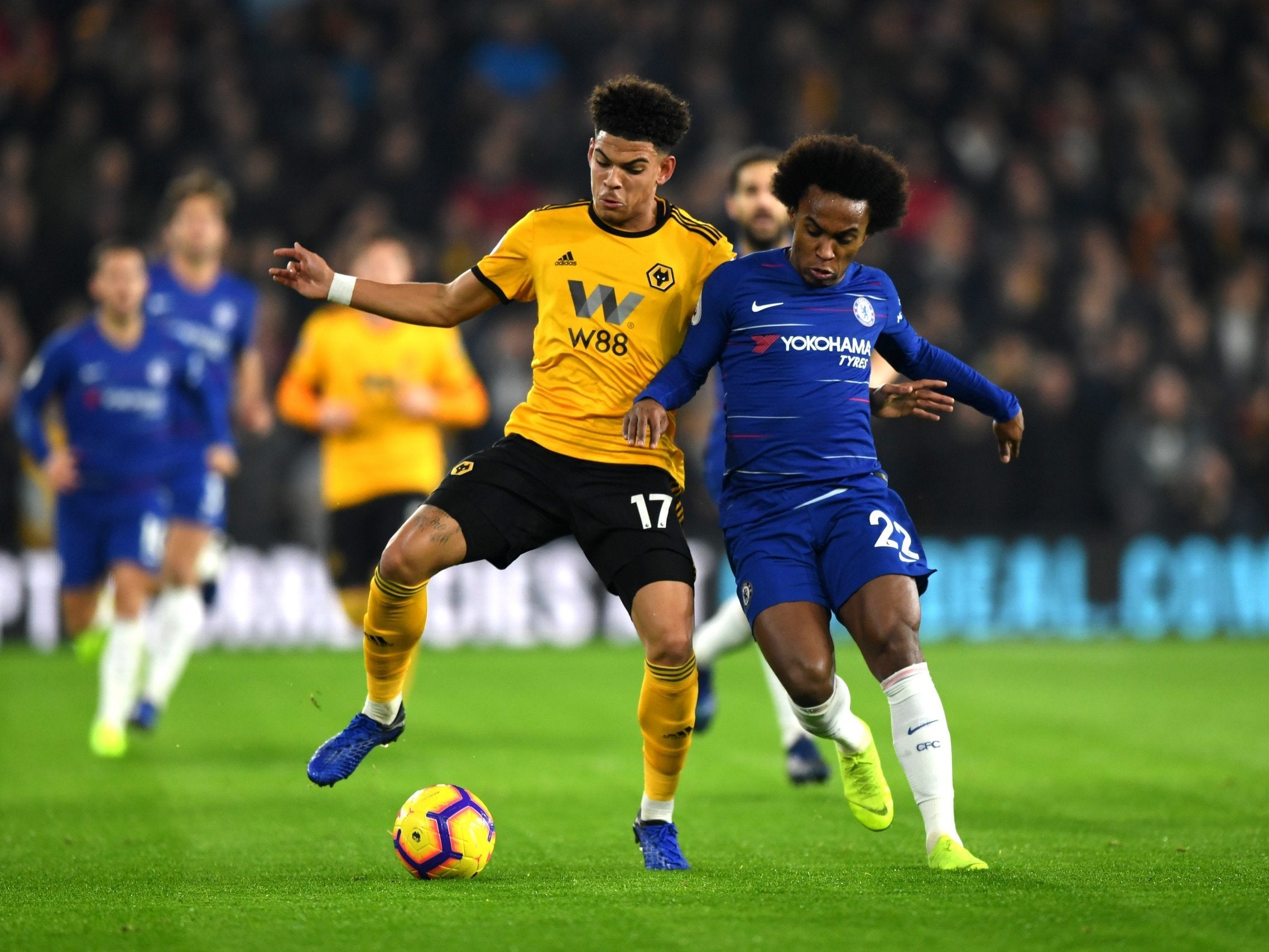 Wolves midfielder Morgan Gibbs-White challenges Willian