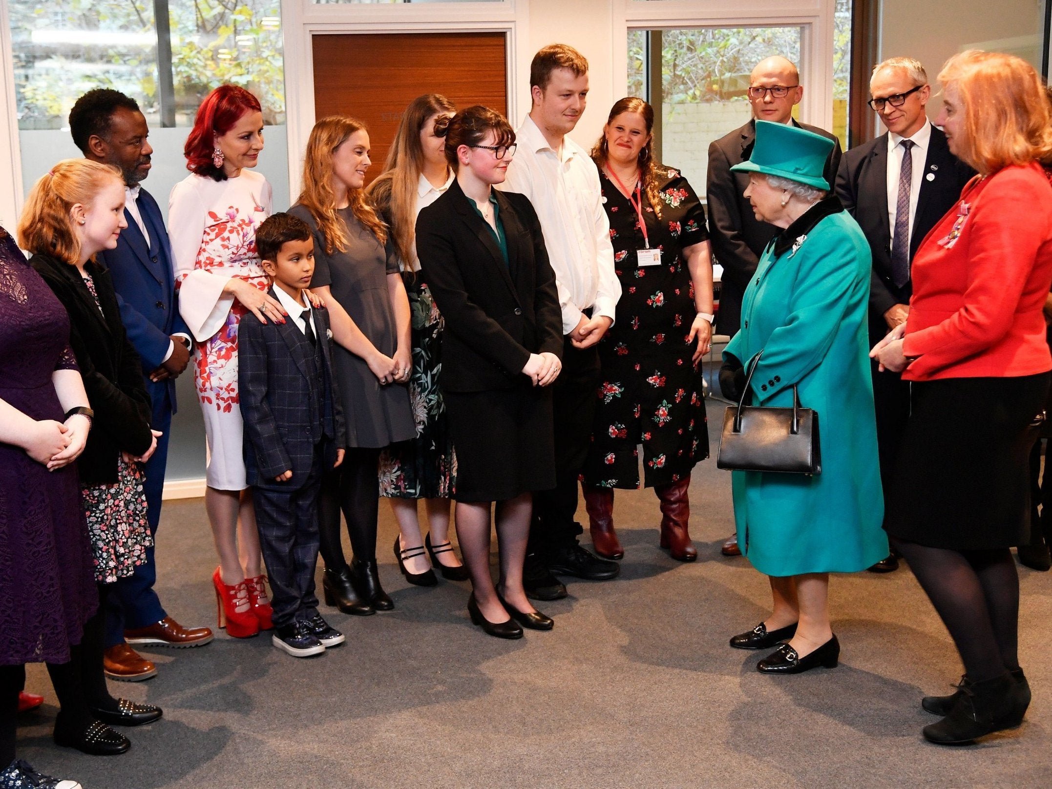 Nine-year-old Nathan Grant was so overwhelmed by meeting the Queen that he crawled out of the room. Queen Elizabeth II during a visit to Coram, the UK's oldest children's charity, to open the Queen Elizabeth II Centre at its base in central London.