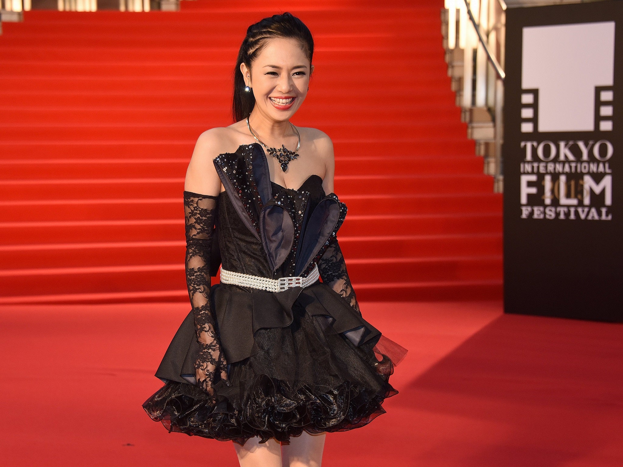 Japanese actress Sola Aoi poses for photographers on the red carpet upon her arrival for the opening ceremony of the 28th Tokyo International Film Festival in Tokyo on October 22, 2015.