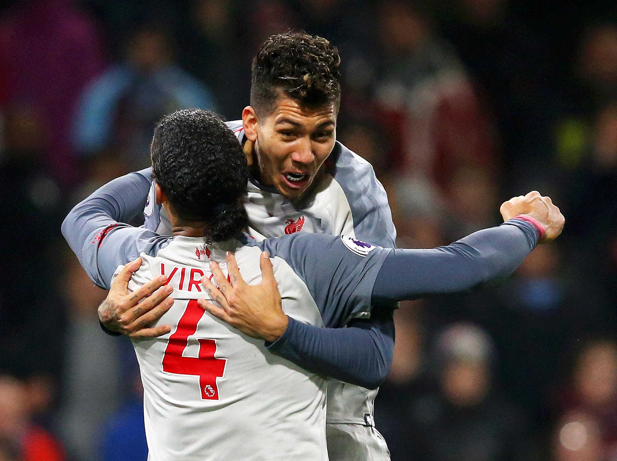 Firmino and Van Dijk celebrate Steve Cook's own-goal (Getty)