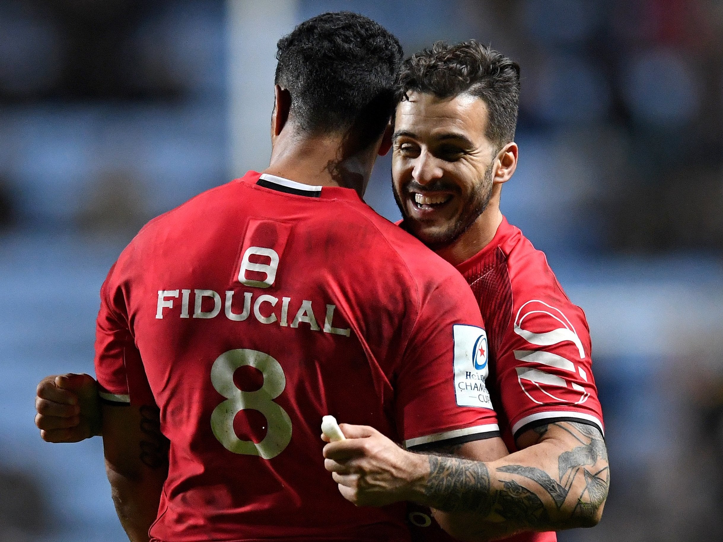 Sofiane Guitoune and Jerome Kaino celebrate at the end of Toulouse's victory