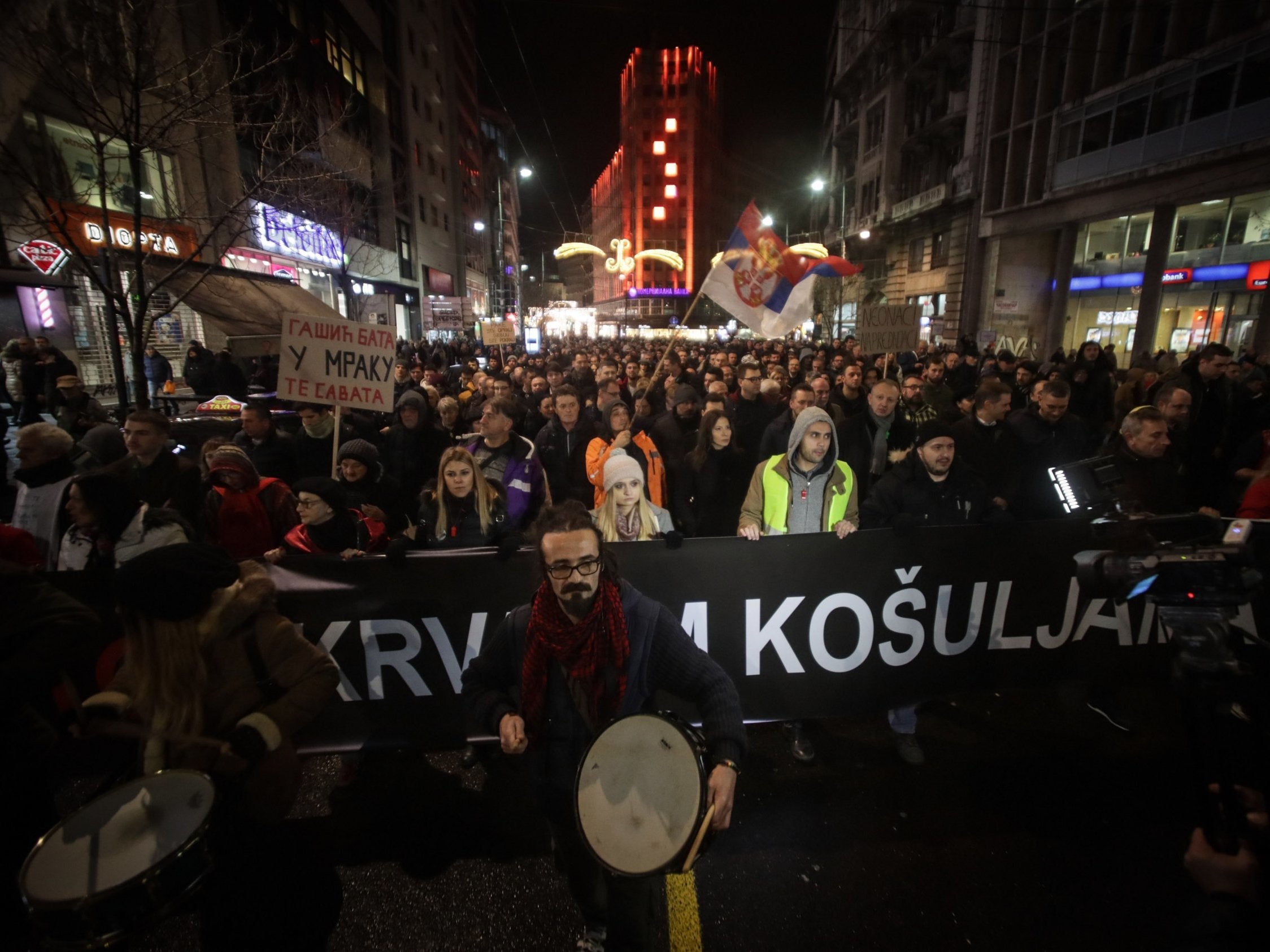 Demonstrators take part in a protest against violence on 8 December, 2018 in Belgrade.