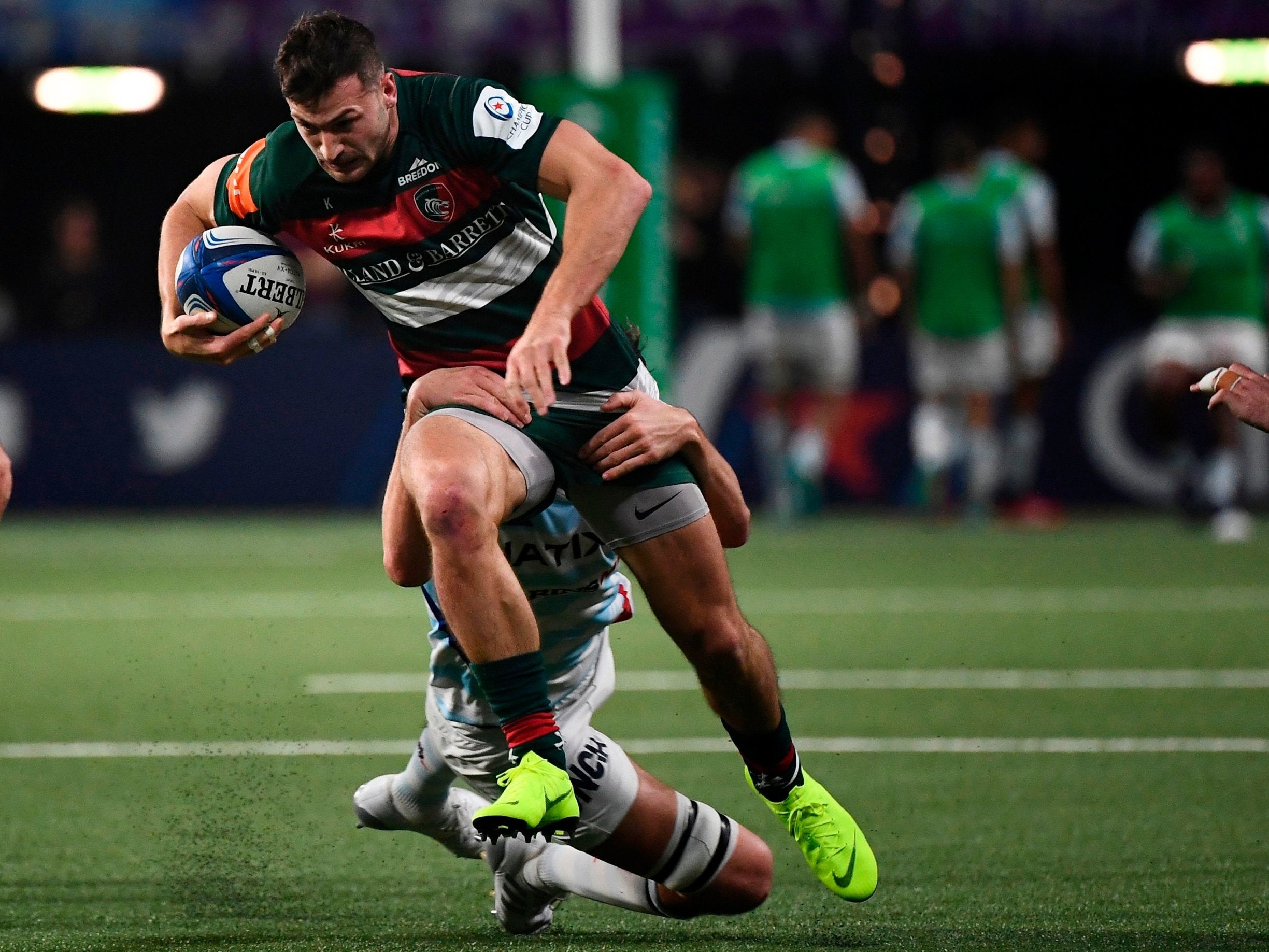 Jonny May tries to escape a Racing tackler