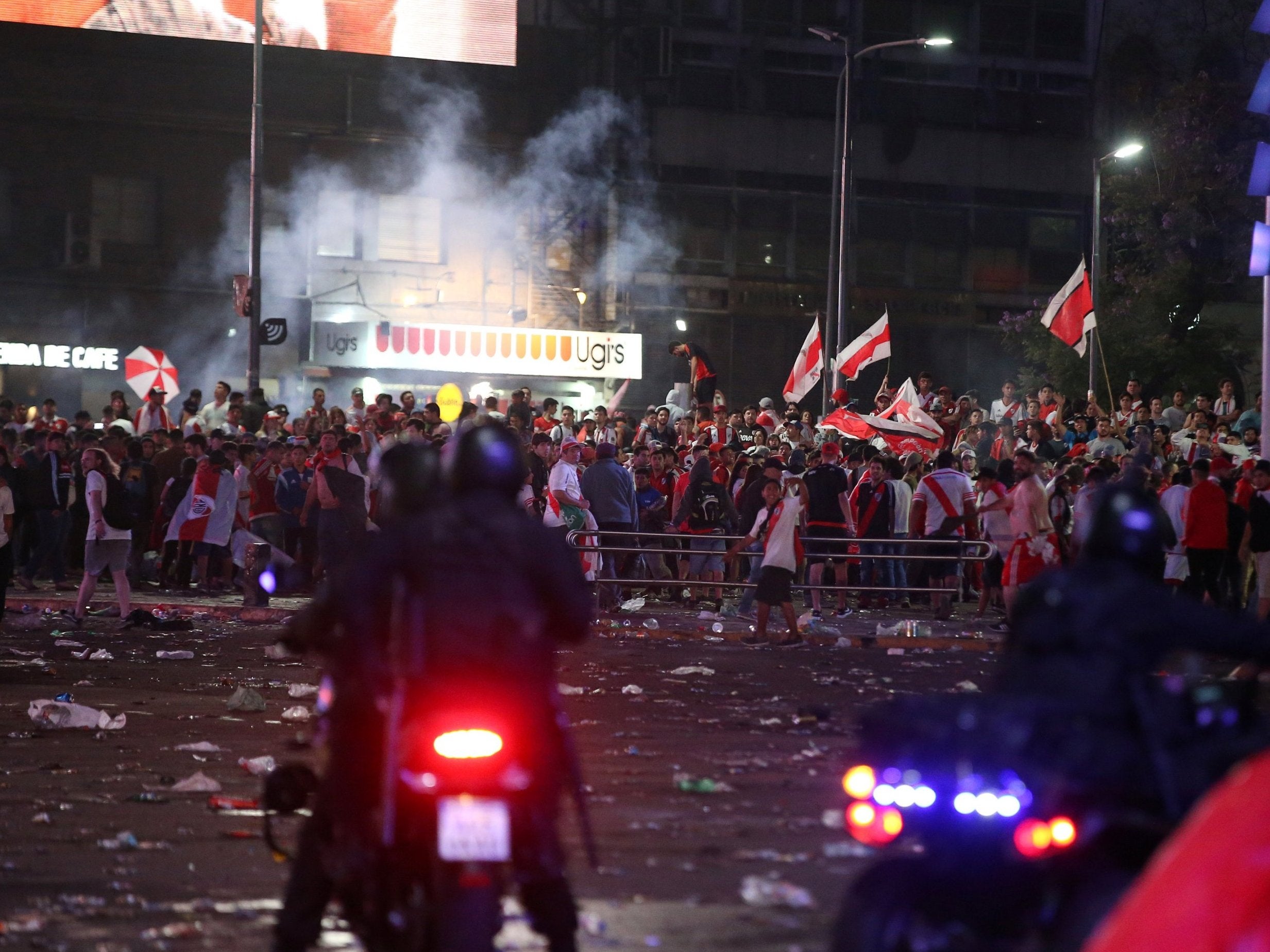 While River Plate celebrated in Madrid, fans clashed with police in Buenos Aires