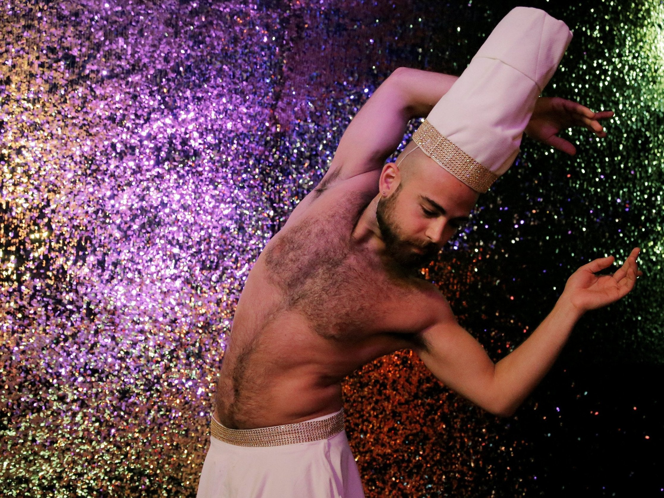 Syrian migrant Haidar Darwish performs during a show at Berlin’s Silverfuture club