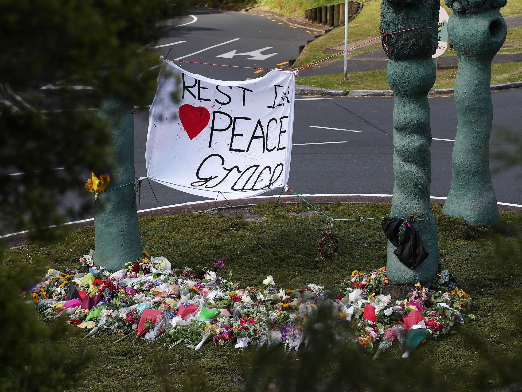 The floral tributes at the Titirangi roundabout grow larger for Grace Millane on 22 December, 2018 in Auckland, New Zealand. The British backpacker’s body was found in a section of bush just near Scenic Drive in West Auckland’s Waitakere Ranges on Sunday, following an extensive search.