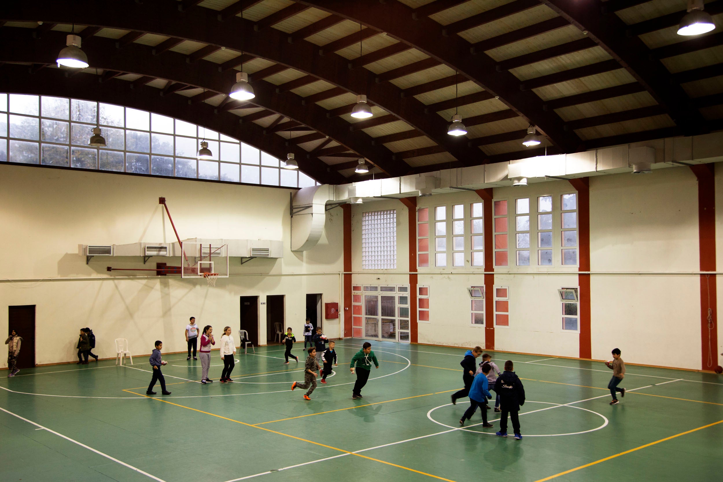Children play indoors on a rainy mid morning break