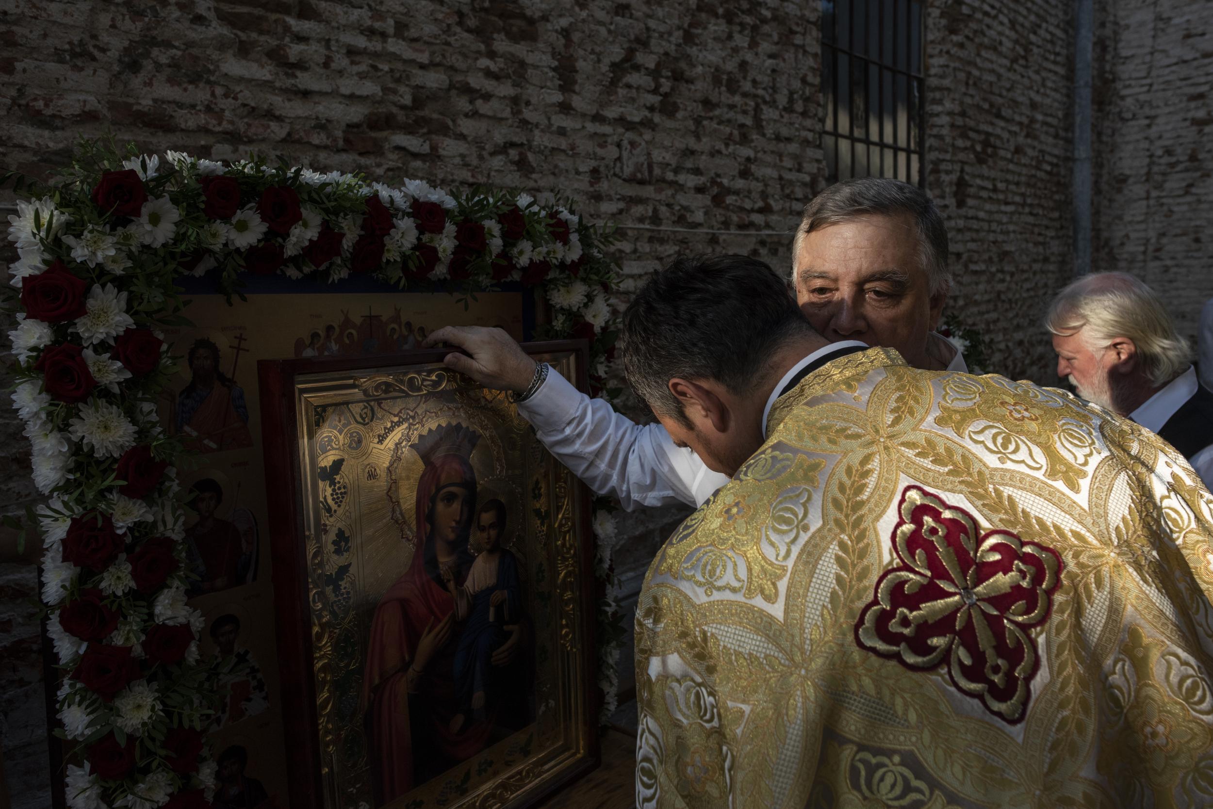 Priests and church members gather for a procession in Bucharest, Romania