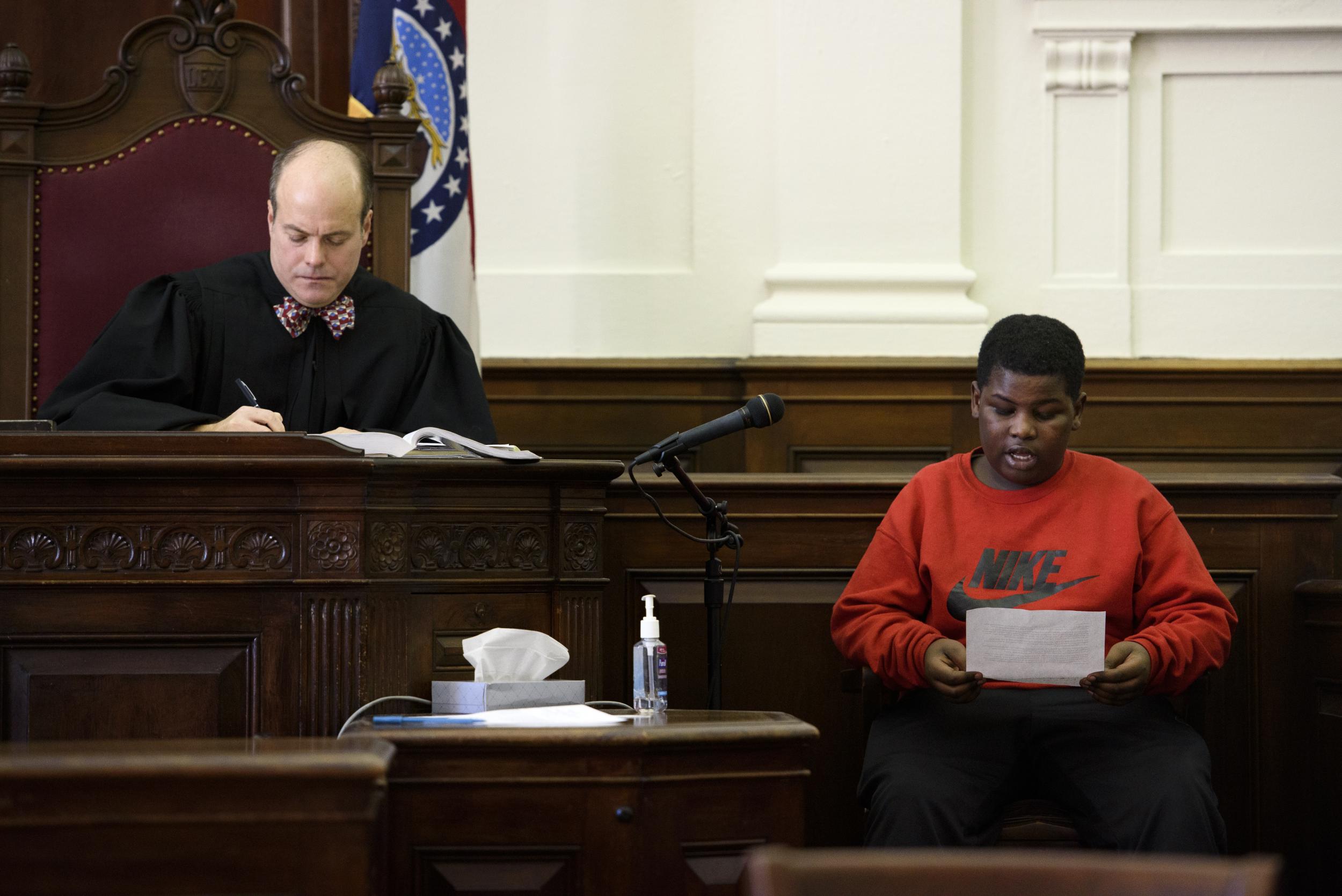 Reggie Jackson, 13, reads a statement during a hearing in St Louis for Victor Whittier, who was convicted in the murder of his sister