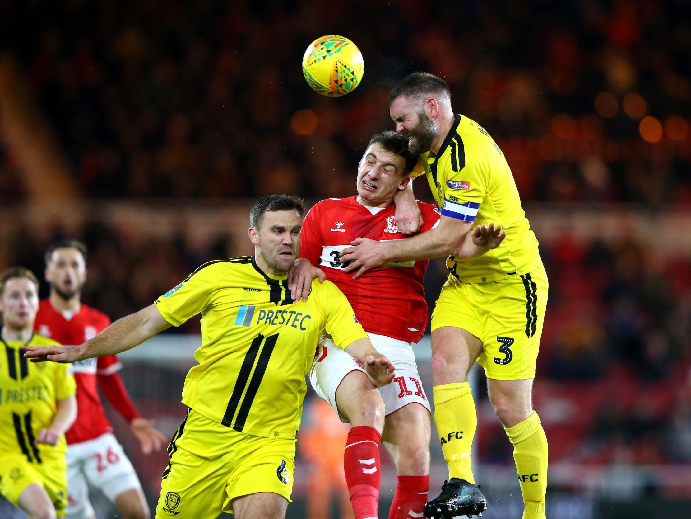 Jordan Hugill competes for a header with Ben Turner and Jake Buxton