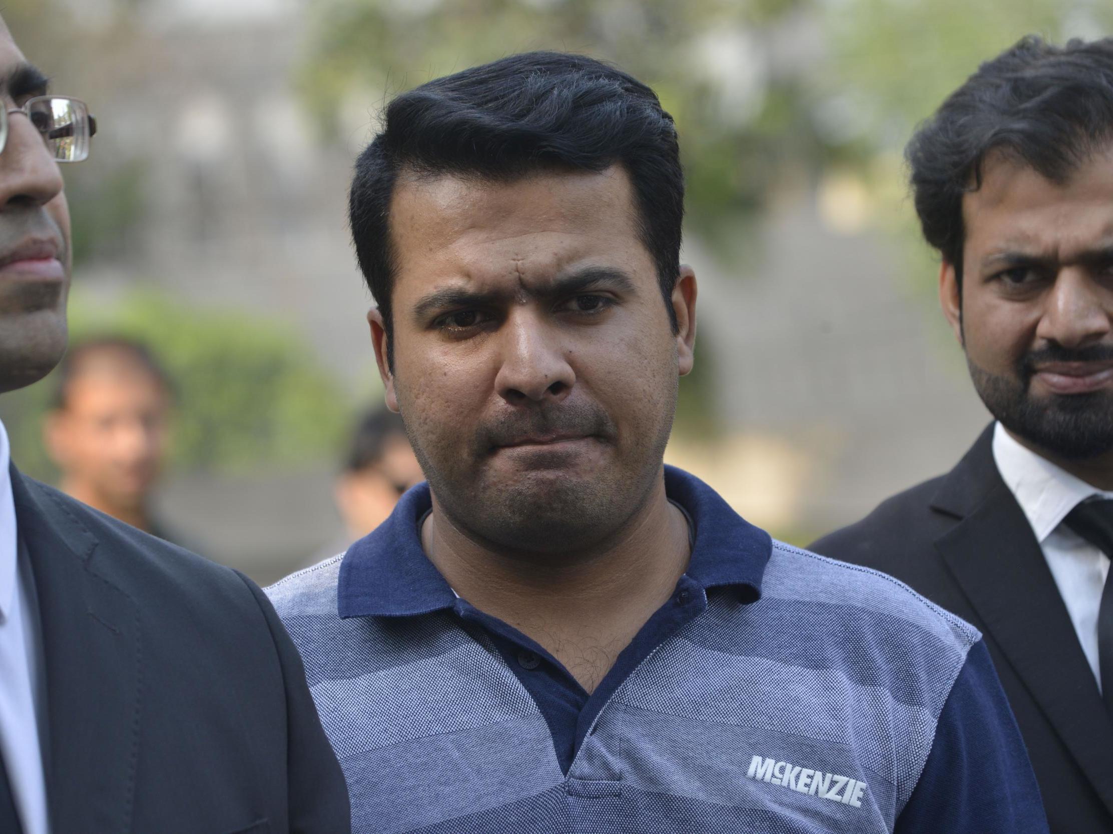 Sharjeel Khan leaves with his lawyers after appearing before a tribunal in Lahore, May 2017