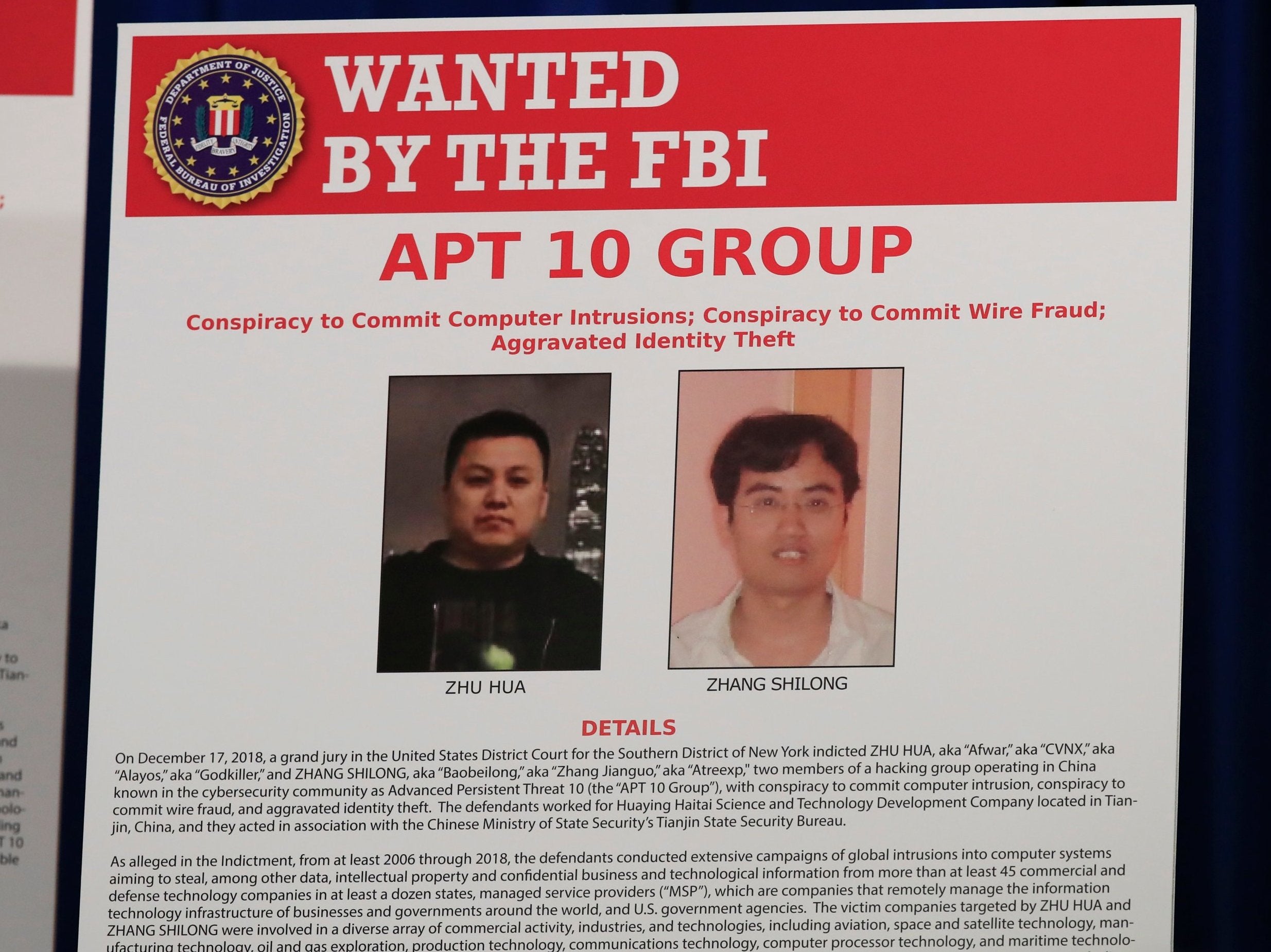 A poster displayed during a news conference at the Department of Justice in Washington